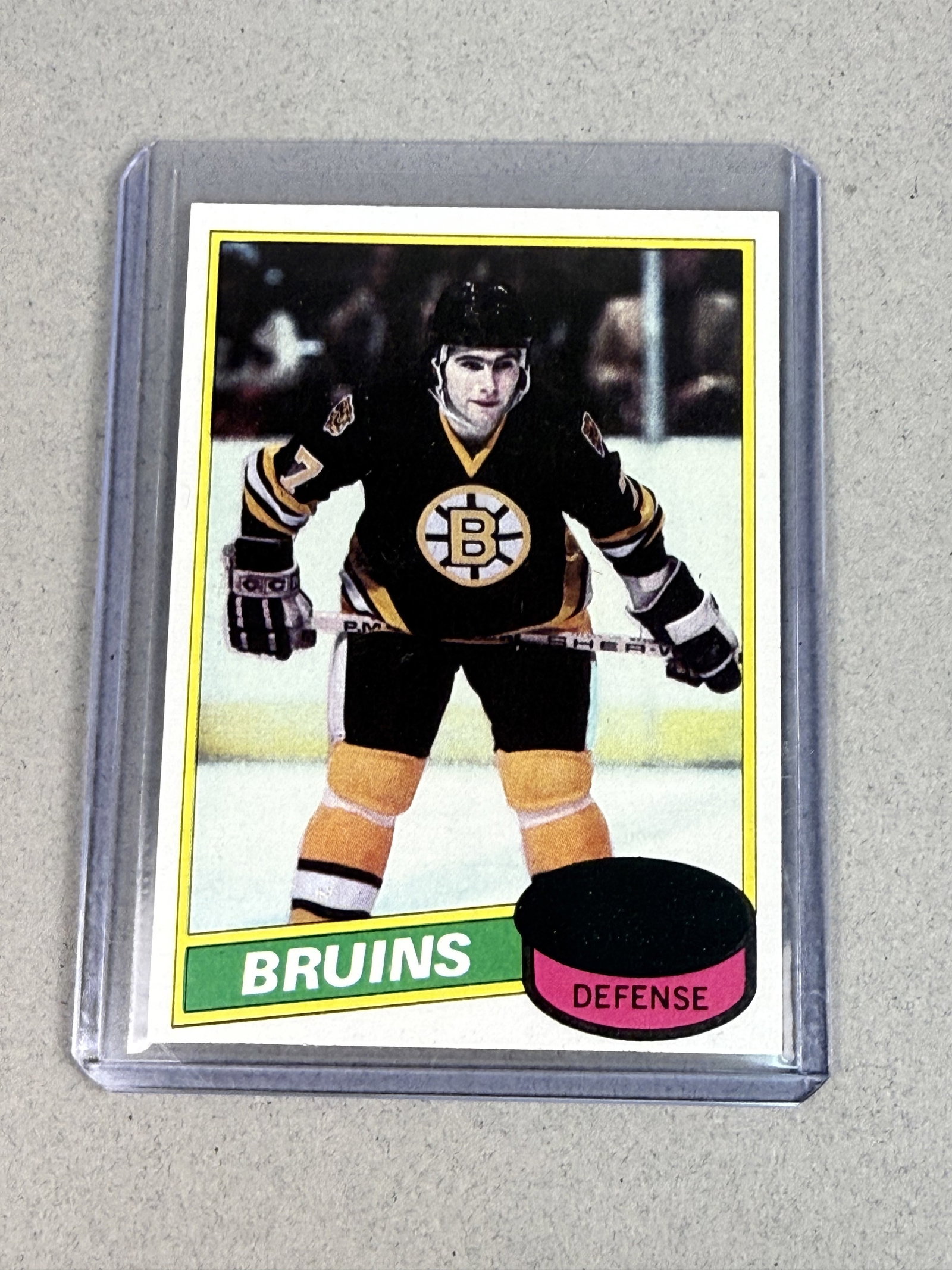 Topps 1980 Ray Bourque Unscratched Rookie Card 140: This original 1980-81 Topps NHL trading card features Hall of Fame defenseman Ray Bourque during his rookie season with the Boston Bruins. The card, designated as number 140, is printed on standard ma