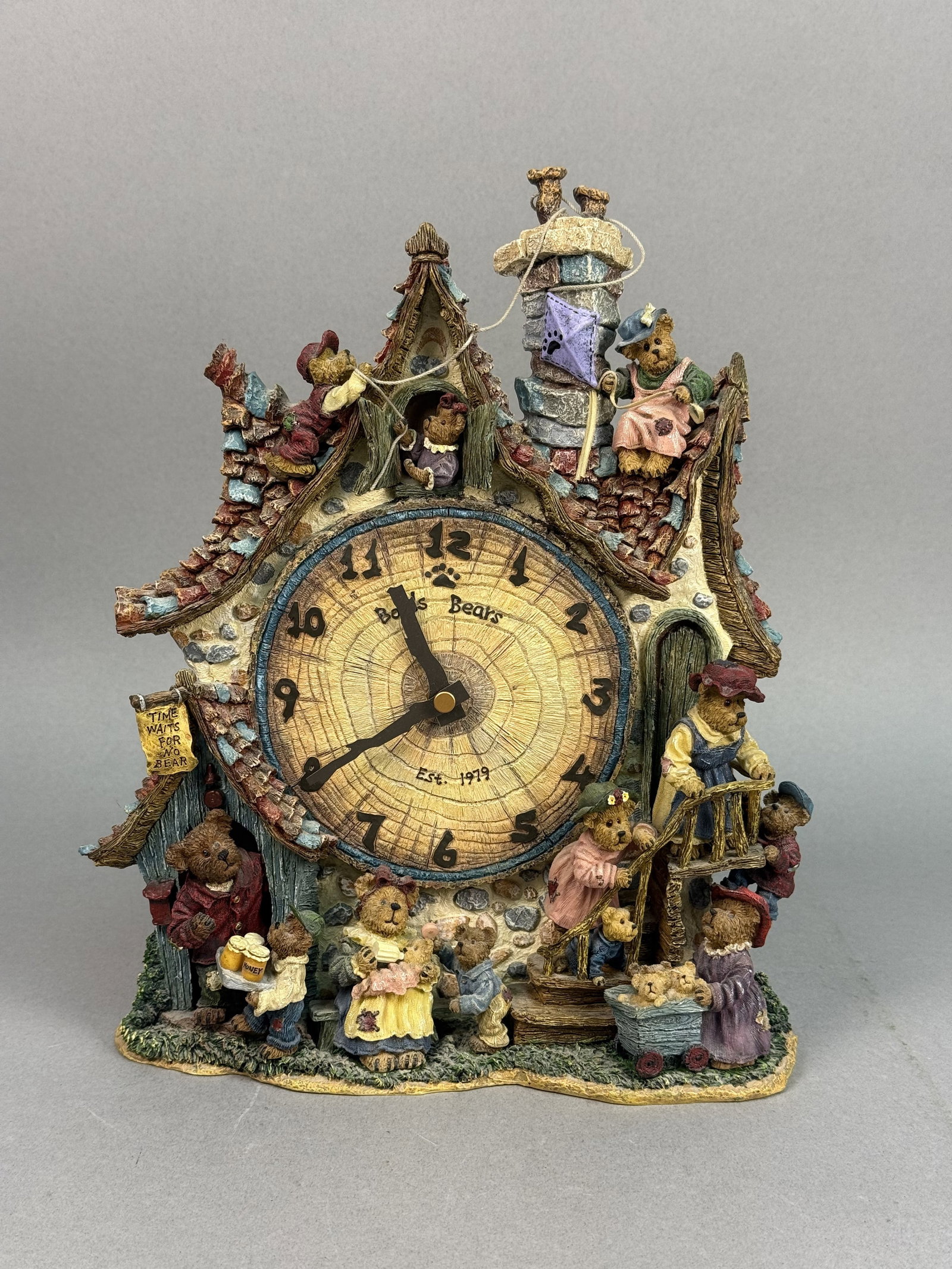 Boyds Bears Danbury Mint Collector Clock: This hand-painted resin mantel clock was produced by The Boyds Collection Ltd. in collaboration with MBI Inc. for Danbury Mint. The sculpture is designed as a whimsical multi-story cottage bustling wi