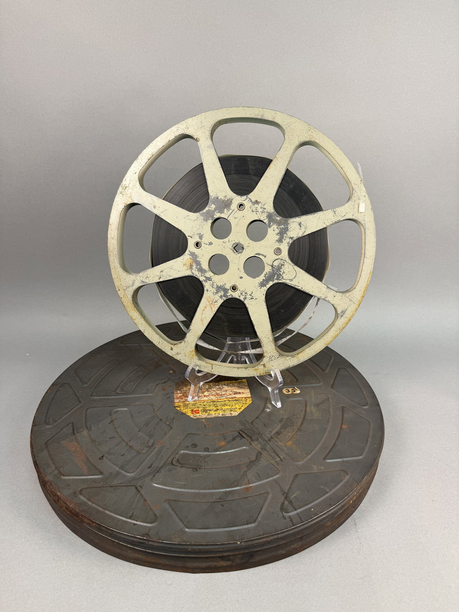 Commonwealth Pictures Frontier Law 35mm Reel: A vintage theatrical distribution print of the 1943 Western film Frontier Law, starring Russell Hayden. This 35mm print is identified as Reel 1 of the production. The film strip features title cards f