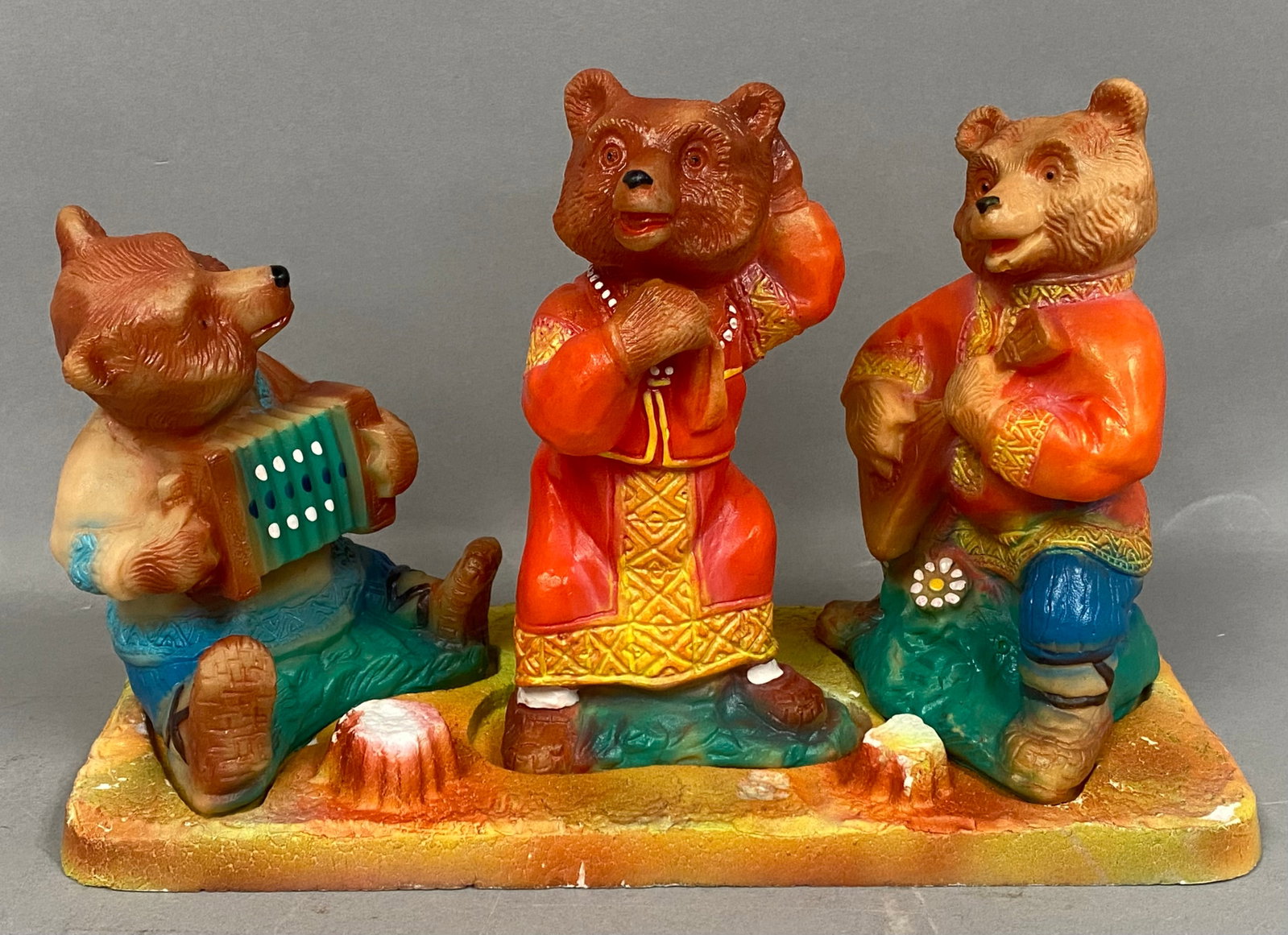 Rubber Russian Folk Bear Figurine Set: A set of novelty rubber figurines depicting three bears dressed in traditional Russian folk attire. The group includes a seated bear playing an accordion, a kneeling bear playing a balalaika, and a