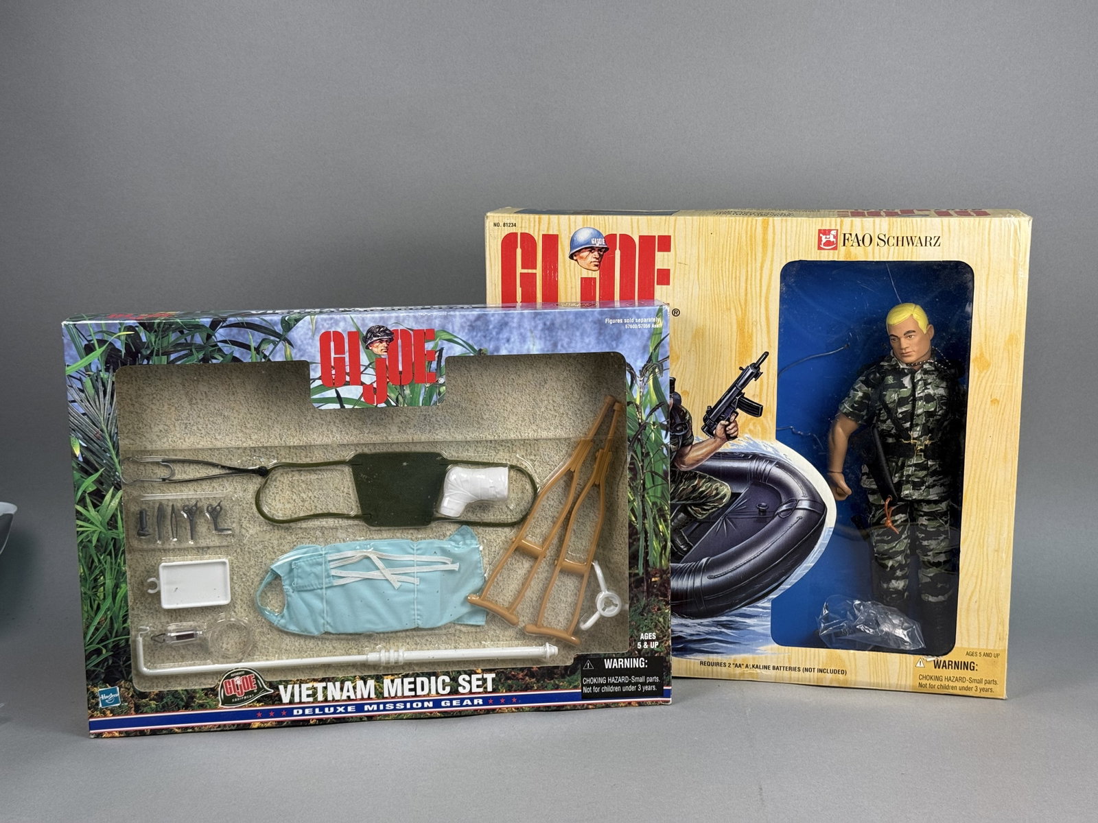 Hasbro GI Joe Navy SEAL & Medic Sets: A pair of 12-inch scale G.I. Joe action figure sets featuring a Navy SEAL with a motorized mission raft and a Vietnam Medic gear accessory pack. The Navy SEAL set, produced by Kenner, includes a