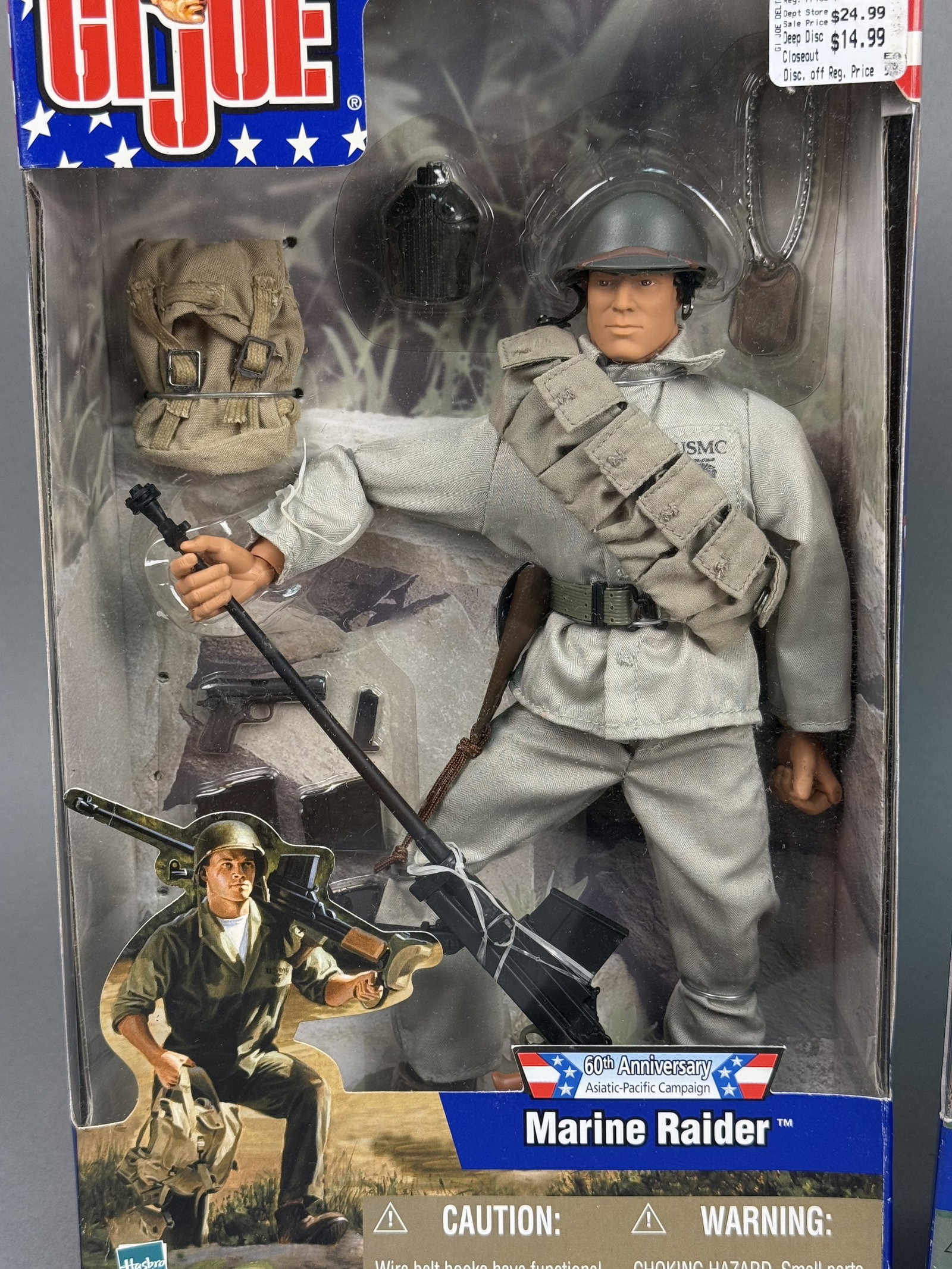 Hasbro GI Joe Marine Raider & Infantry: A pair of vintage Hasbro G.I. Joe action figures in their original factory-sealed window boxes, dating to 2001. The first figure represents a Marine Raider from the 60th Anniversary Asiatic-Pacific Ca