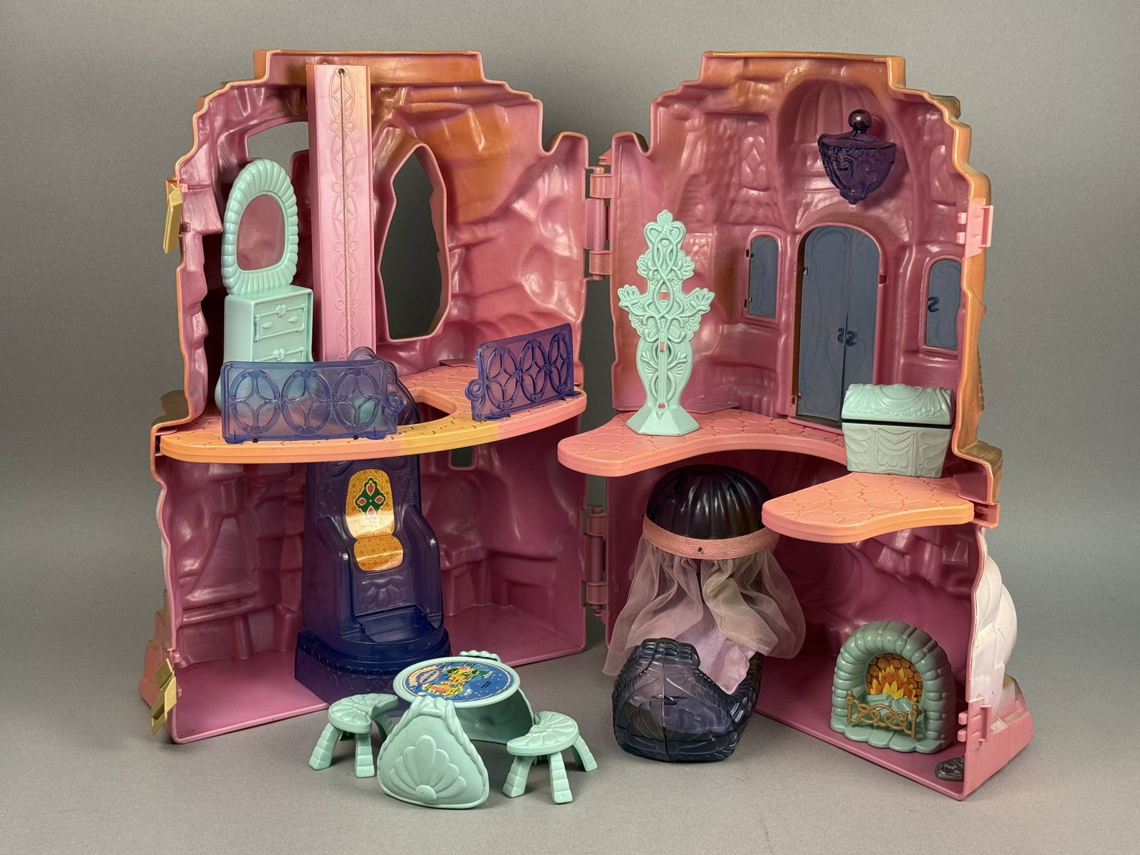 Mattel Crystal Castle She-Ra Playset: This 1984 Mattel She-Ra: Princess of Power Crystal Castle playset is constructed from molded plastic in shades of pink, white, and gold paint. A collection of coordinated accessories is included: a tr