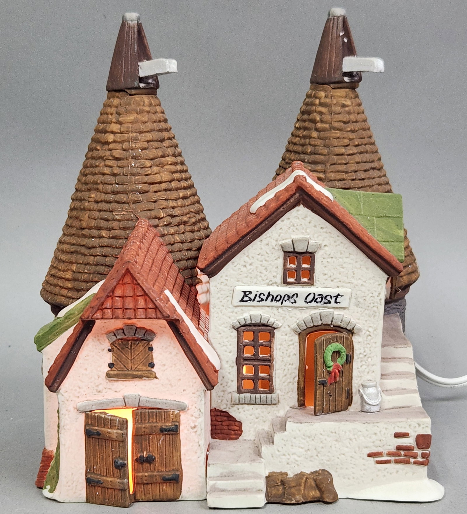 Dept 56 Porcelain Bishops Oast House: This handpainted porcelain building is titled Bishops Oast House, part of the Dickens Village Series within the Heritage Village Collection by Department 56. The underside is marked with an underglaze