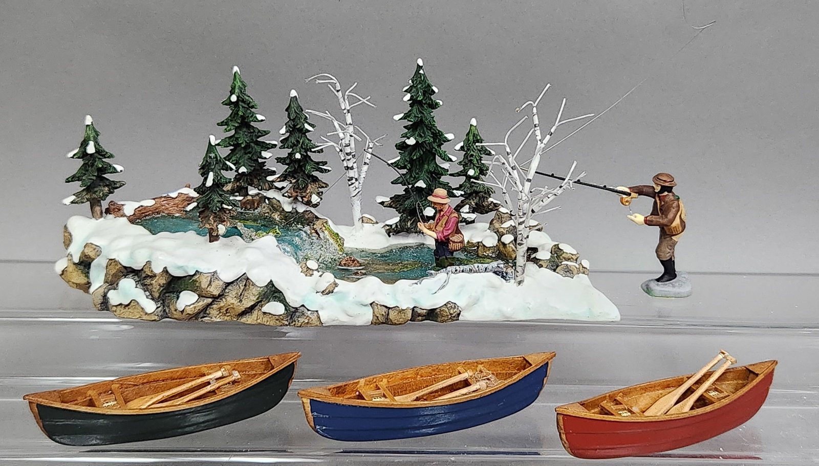 Dept 56 Village Accessories Collection: This collection of hand-painted polyresin miniature village accessories by Department 56 includes three retired winter-themed sets. The primary piece is The Trout Stream (product number 56.52834). The