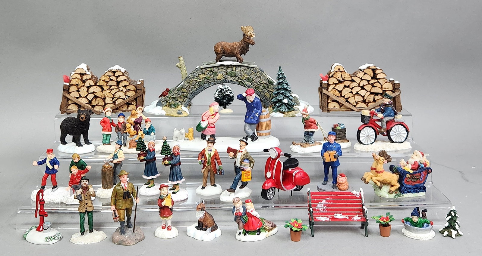 Winter Village Figures: This large assortment of winter village miniature figurines and scenic accessories is constructed from ceramic & resin. The collection is in very good overall condition, with vibrant paint and no