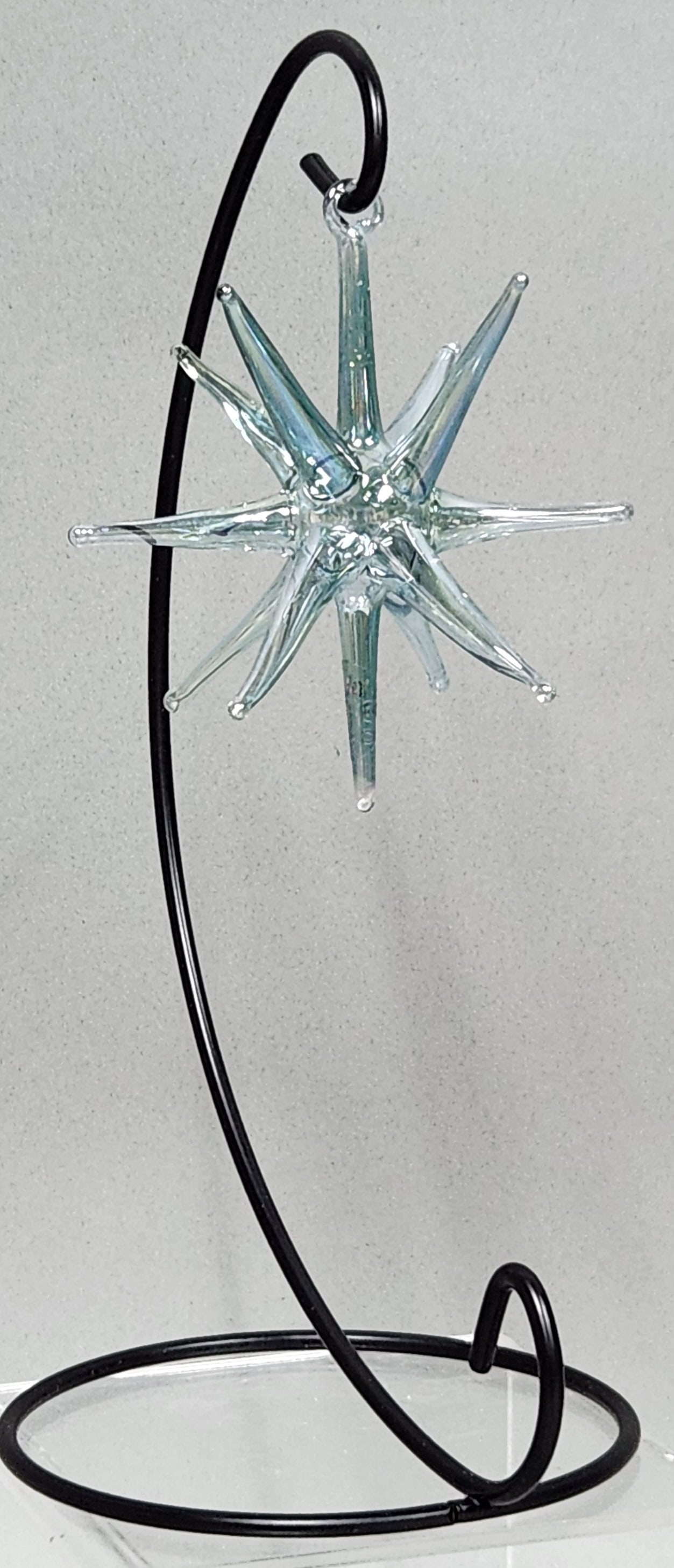 Italian Glass Star Ornament: Stand not included. A Venetian art glass ornament and coordinating display stand. Diameter: 3.75 inches. The ornament is in excellent vintage condition with no visible chips, cracks, or repairs. The