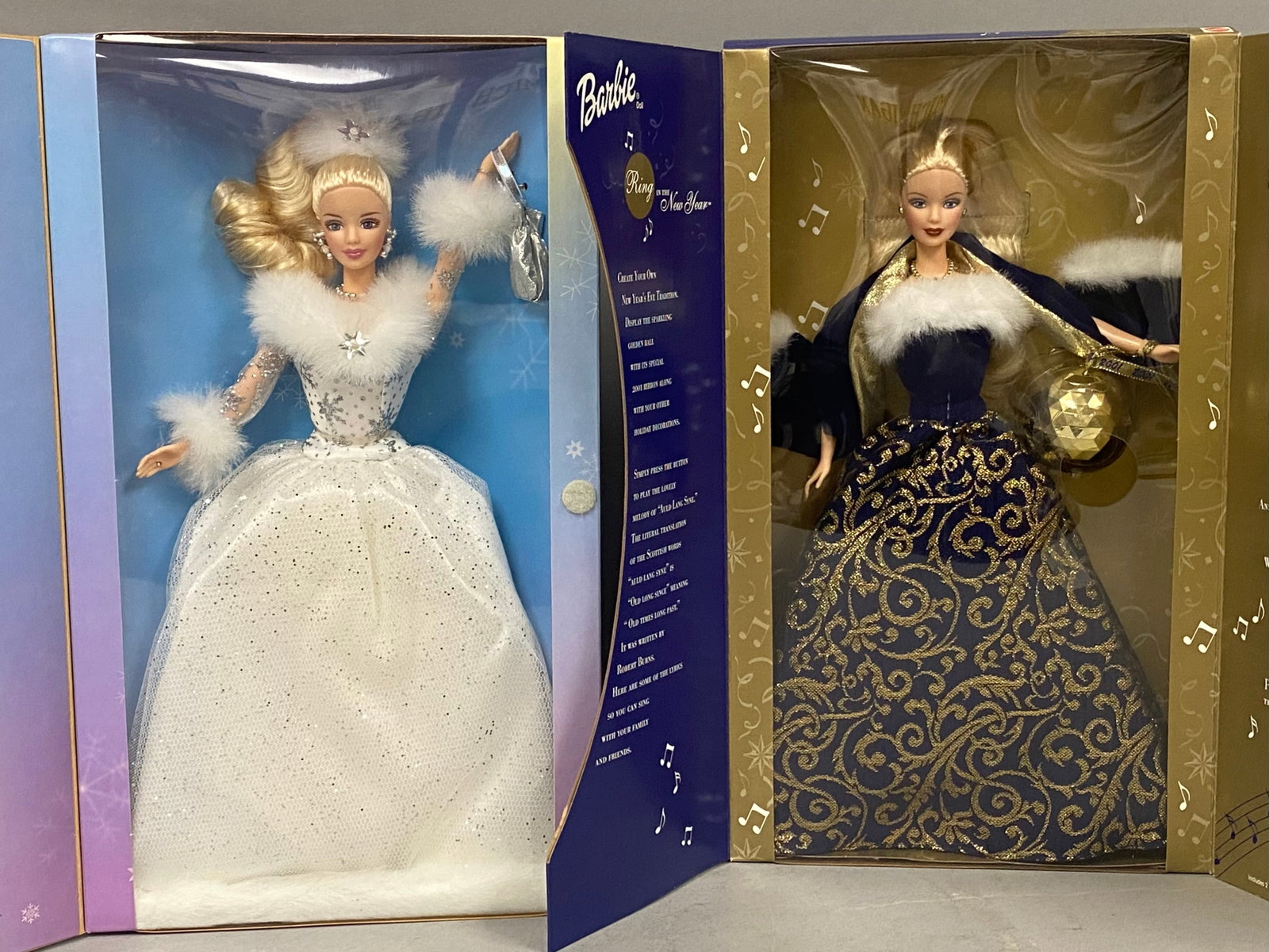 Mattel Winter's Reflection & Ring New Year Barbies: Two Mattel vinyl fashion dolls from the holiday collection in their original factory packaging. The first is the 2002 Winter's Reflection Barbie, model number 55682. The doll features rooted blonde ha