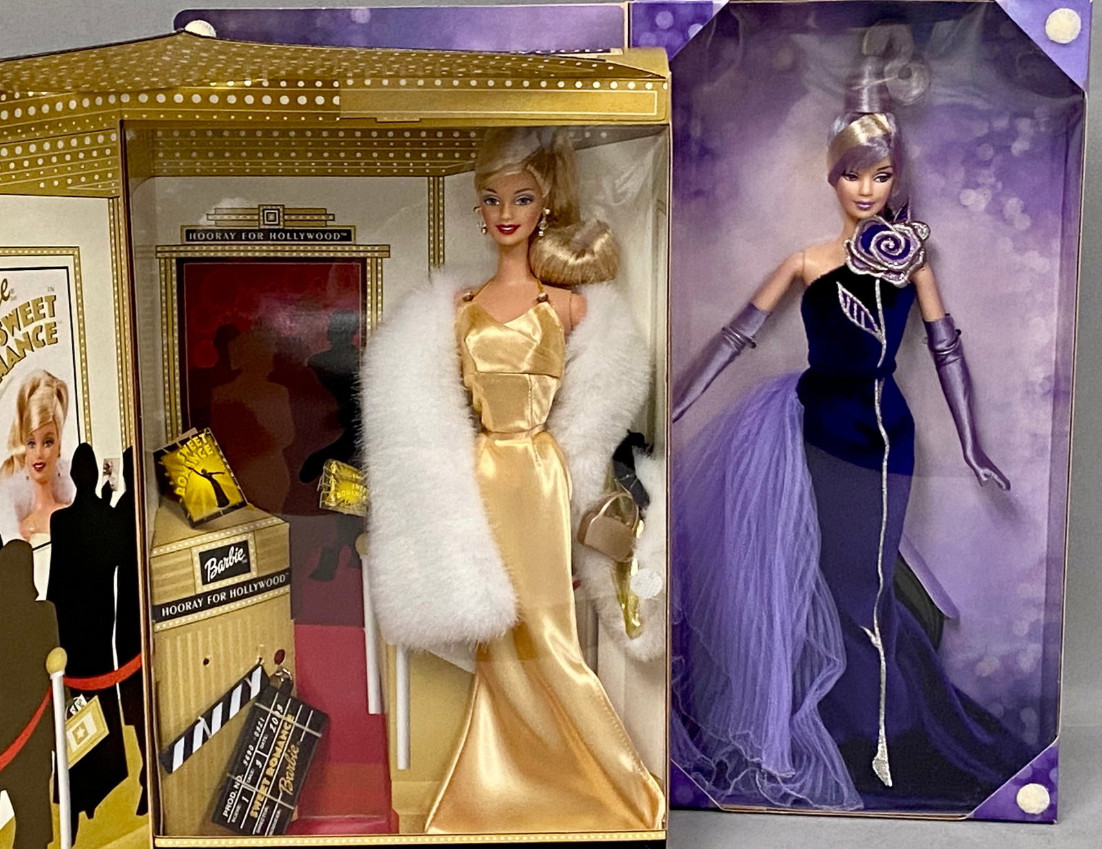 Mattel Bob Mackie & Hooray For Hollywood Barbies: A pair of vinyl fashion dolls manufactured by Mattel, presented in their original factory packaging. The first is a 2002 Special Edition Hooray for Hollywood Barbie, product number 56901, dressed in a