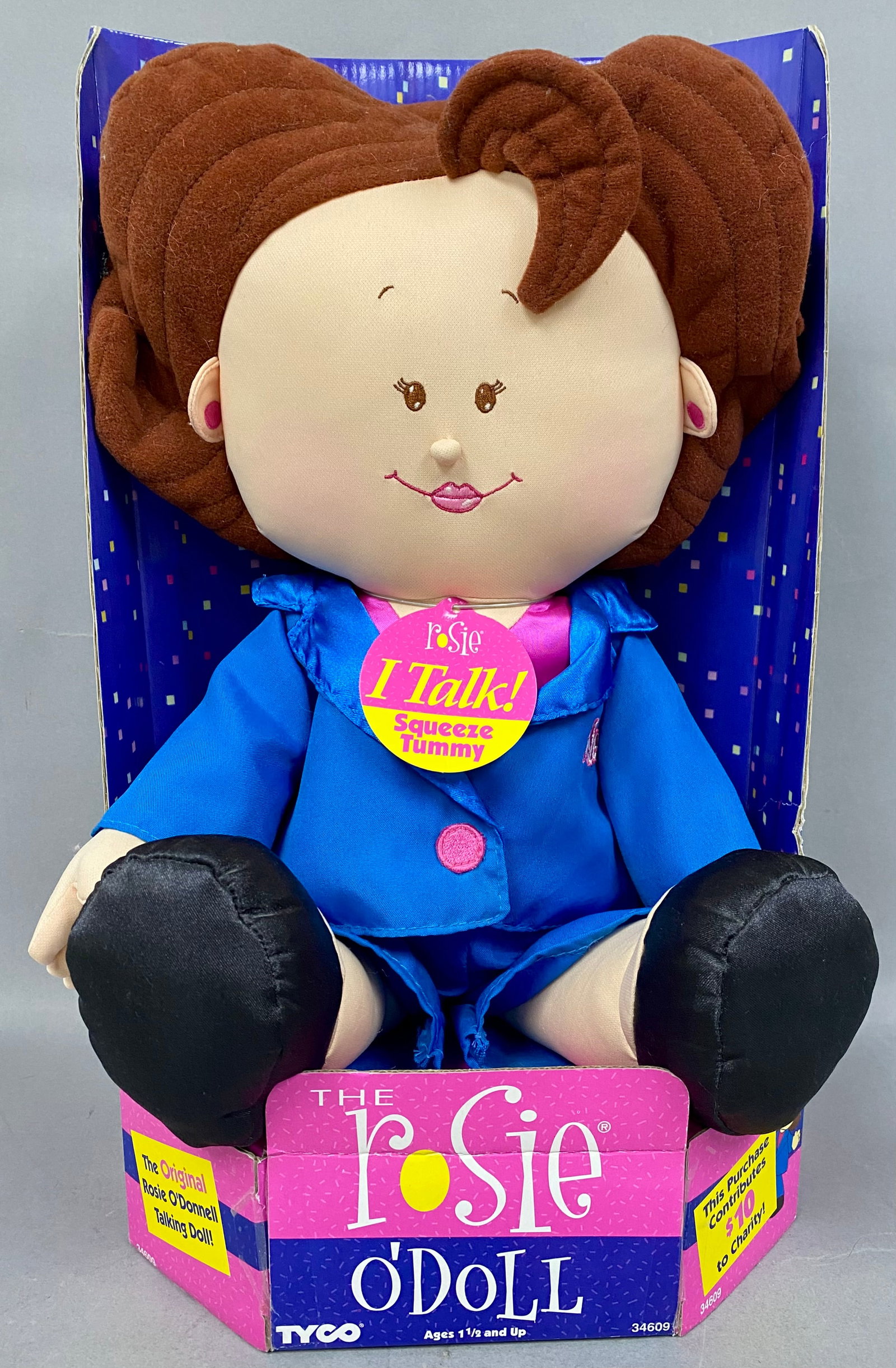 Tyco Talking Rosie O'Donnell Doll: This 1997 Tyco talking plush doll, titled The Rosie O'Doll, features the likeness of celebrity Rosie O'Donnell. The figure is dressed in a blue synthetic fabric jacket and matching pants with black sa