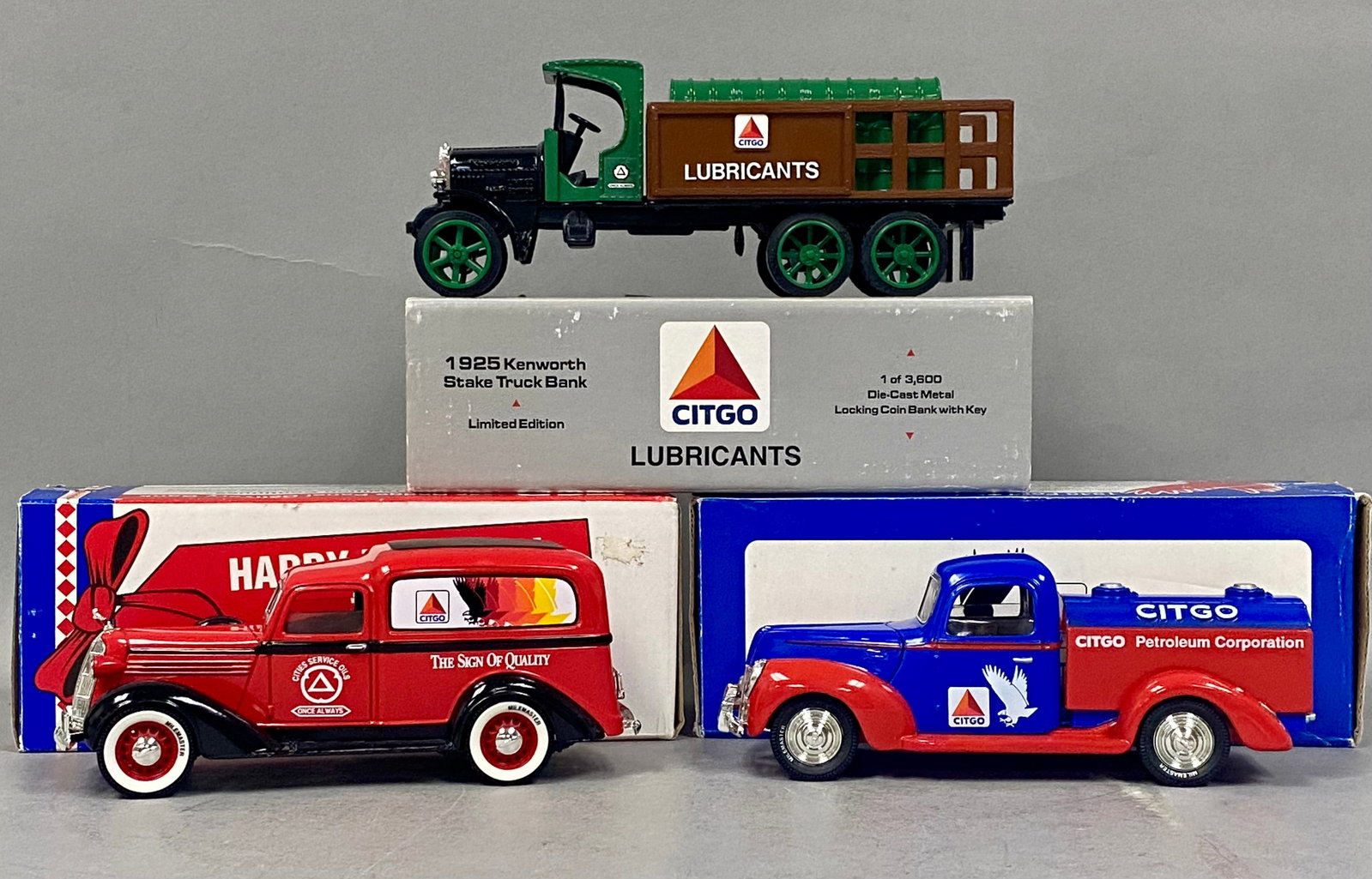 3 Ertl & Liberty Classics CITGO Truck Banks: This set of three die-cast metal toy vehicle coin banks includes vintage-themed trucks featuring CITGO and Cities Service branding. The first is a 1925 Kenworth Stake Truck produced by The Ertl Compan