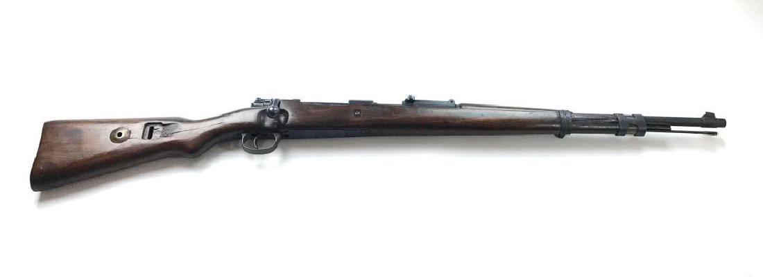 German Mauser Model 98K 8MM Bolt Action Rifle, 1941: This Mauser Model 98K is in an 8MM German WW2 military 1941 bolt action rifle, has a wood stock and is in good condition with minimal wear. The Serial number is 7962. ALL GUNS PURCHASED ONLINE ARE WIR