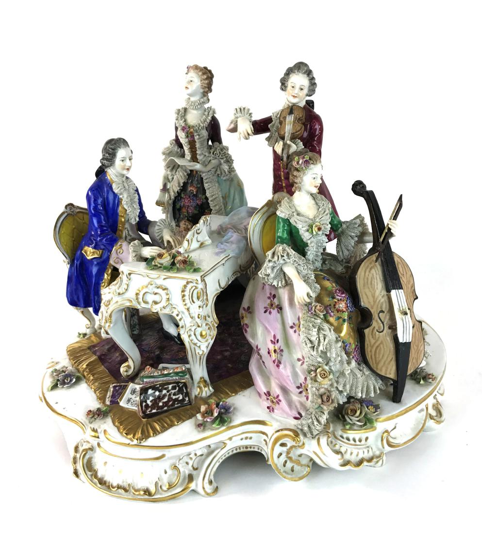 Vintage Four Figure Volkstedt Dresden Crinoline Music G: This is a wonderfully preserved Dresden crinoline group depicting piano, cello, violin, and singer. The longbow for the cello player is missing and possible repairs to the cello where the bridge shoul