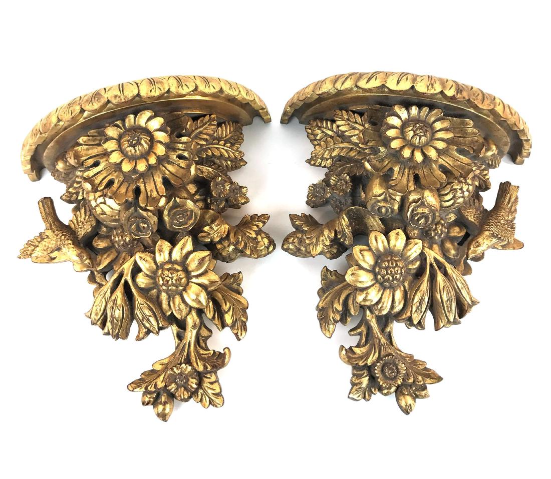 Pair of Flowers and Birds Wooden Carved Wall Sconces: This lot is for a pair of wall sconces depicting flowers and birds. Please note a left wing is missing on one of the birds. Each wall sconce measures approximately H 13" W 12" D 6.5". Please Note: