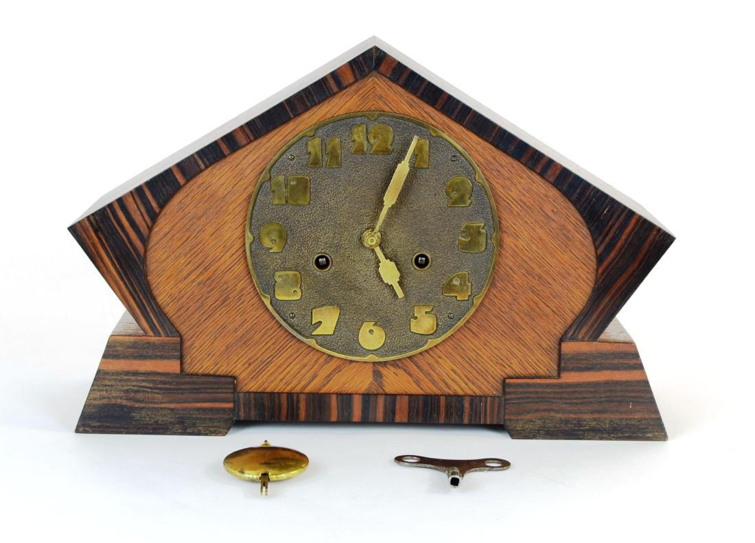 Junghans Original Art Deco Clock: Beautiful Art Deco wooden cased clock by Original Junghans out of Wurttemberg, Germany. The case is in good condition with one small depression on the top left roof and a small scratch on the right bo