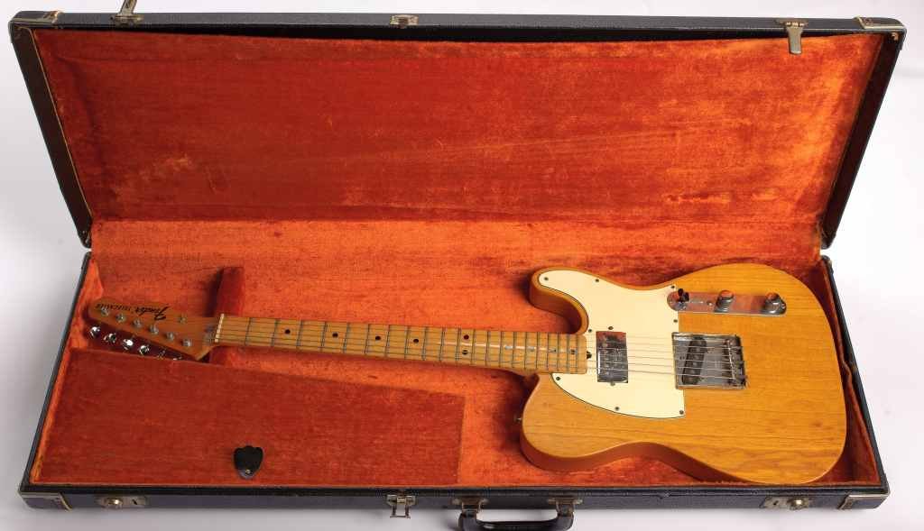 Fender Telecaster Electric Guitar with Case: Fender Telecaster with DeArmond humbucking pickup in neck position. Maple neck, clear finish, white pickguard. Serial number (available by email request) puts year of manufacture at 1973. This was the