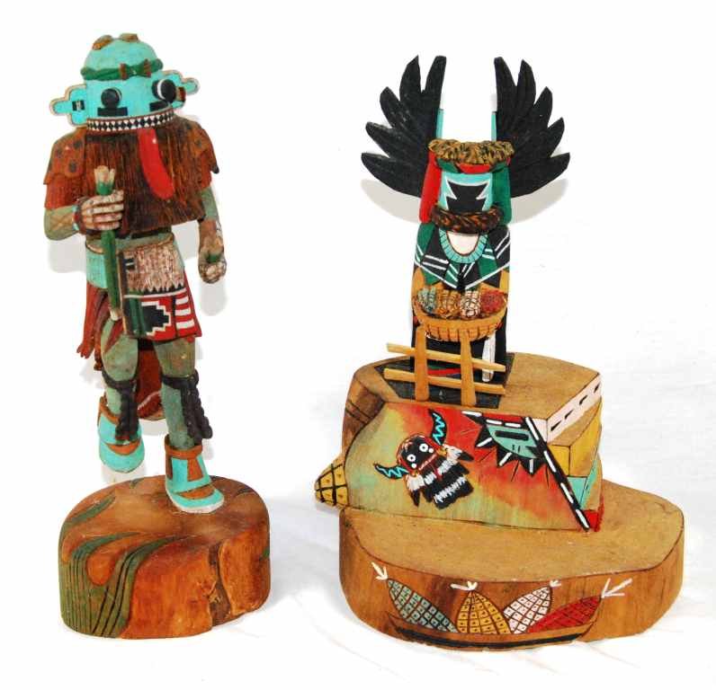 Pair of Carved Wood Native American Hopi Kachina Dolls: This lot includes 2 carved wood Kachina Dolls. The first doll is signed “Crow Mother, Hopi, Alton Pashano” and measures 9.5 inches tall. The second doll is signed “Herbert Sehongva (Sukwa-Hu-Kac