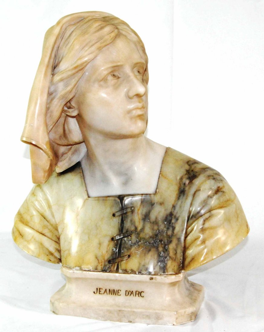 Antique Jeanne D' Arc Marble Bust Statue, French: This Antique Jeanne D' Arc Marble Bust Statue measures 18" x 21". The bottom is inscribed "Jeanne D'Arc", and has very intricate detail work. There are some minor chips along the bottom piece where it
