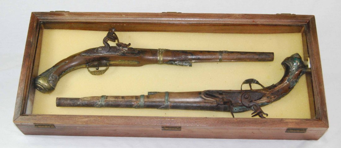Pair of Flintlock Pistols in Vintage Wood Case,: This is a Fantastic Pair of Antique Mediterranean Style Pirate Flintlock Pistols in a Vintage Wood Case. These two relic flintlocks, although showing lots of wear, are sure to have seen lots of high s