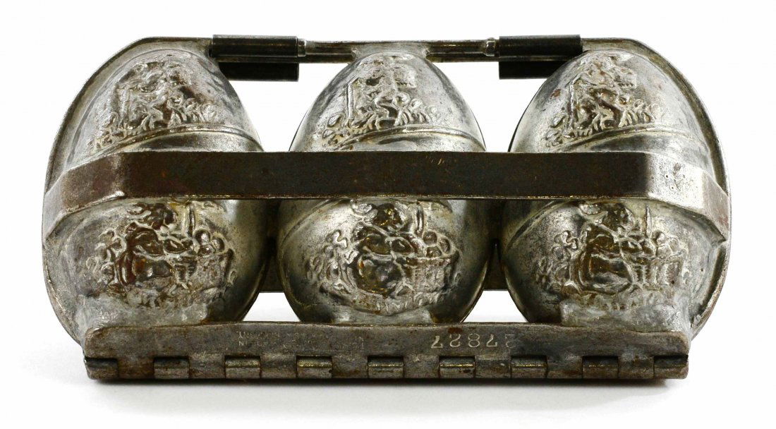 Anton Reiche, Dresden German Chocolate Easter Egg Mold: This is a Rare Antique Anton Reiche Dresden German Chocolate Easter Egg Mold with Rabbits. This piece is in great condition with tight clasps. The hinge is marked “Anton Reiche Dresden” “TCW Can