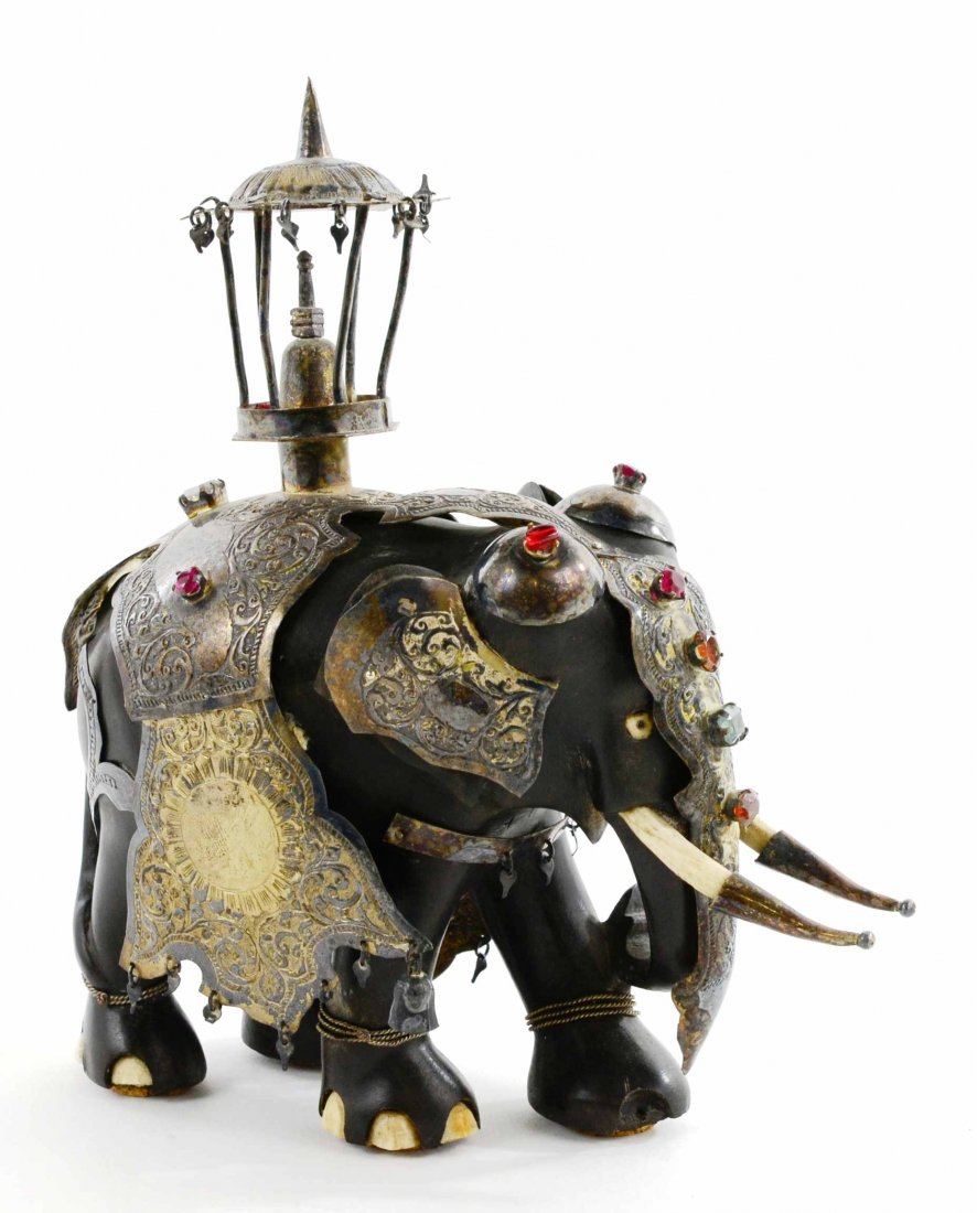 Ebony Wood Sculpture of Elephant w/ Bone/Ivory: This Antique Ebony Wood Sculpture of an Elephant with Bone / Ivory and Hand Tooled Silver (ca. 1880), measures approximately 8.5”T x 7.25”L x 3.5”W. The Elephant weighs approximately 1.93 LBS. T