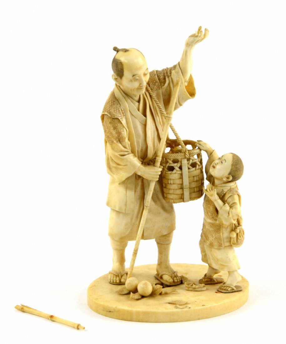 Signed Japanese Carved Ivory / Bone Carved Figure: This is a Finely detailed Antique Oriental Ivory / Bone Carved Figure of a Man Picking Fruit with a Child from the 1920's. The figure is signed on the underside where you can see the natural striation