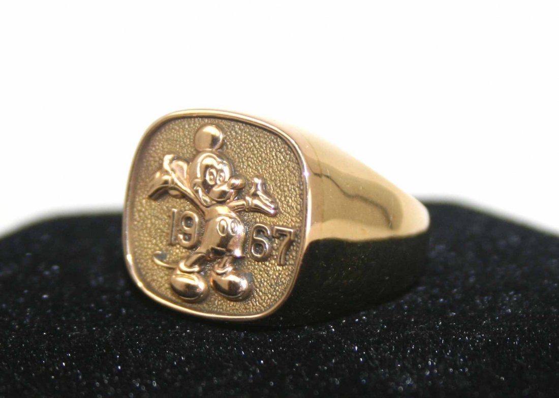 Vintage 1967 Men’s 10K Gold Disney Mickey Employee Ring: This Vintage 1967 Men’s 10K Gold Disney Mickey Mouse Ring is solid 10K gold, is currently a size 10, and weighs approximately 15.4 grams. The inside of ring is marked “CTO 10K” and engraved “7