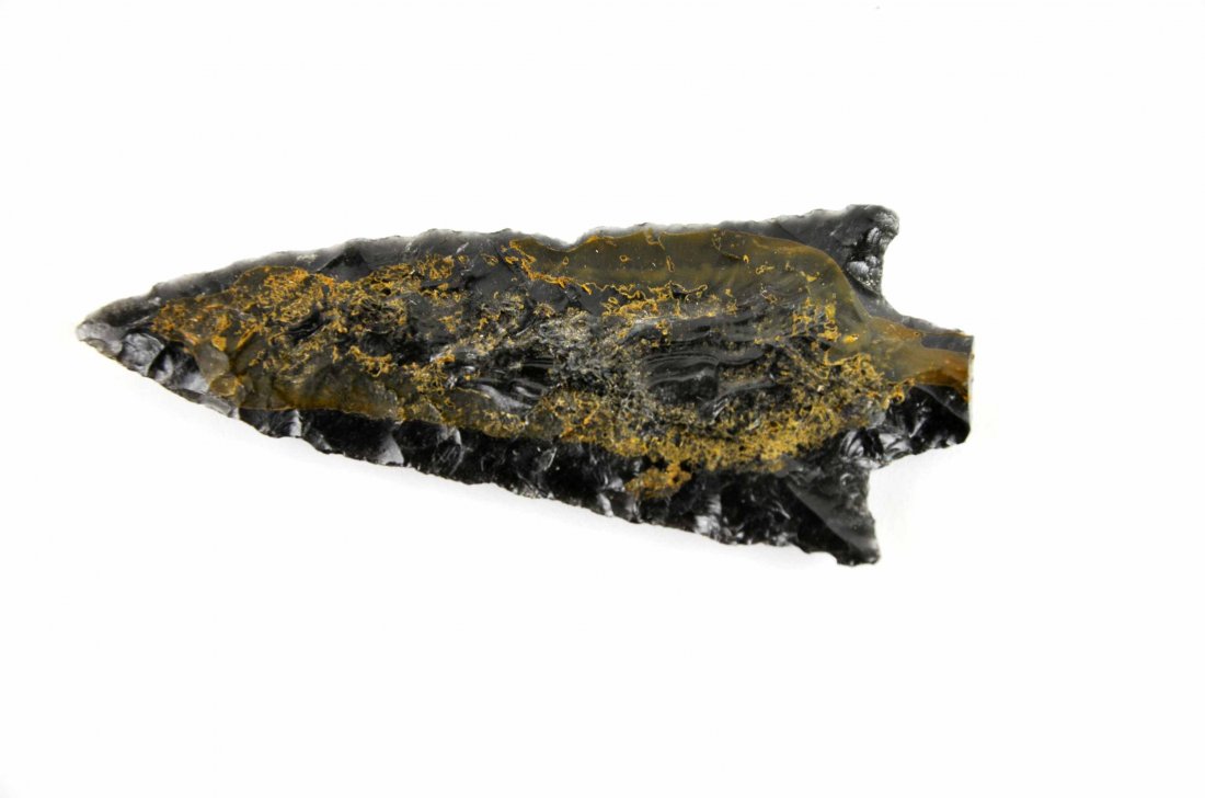 Large 3” Obsidian Arrowhead Spear Point: This is a large 3” Obsidian Arrowhead Spear Point. This piece is well made and is semi translucent. This piece will stand out in any collection. This piece appears to be a middle archaic relic and a