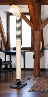 Mario Botta: Shogun model floor lamp, 1980sBlack and white metal, h. 195, with light cover 210 cm, production Artemide, 2 slight abrasions in the floor lamp.Provenance: private collection