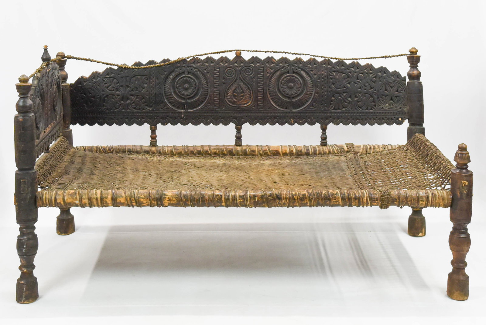 19th Century Swat Valley Himalayan Settee: Hand carved wood, bamboo, and rattan woven seat.