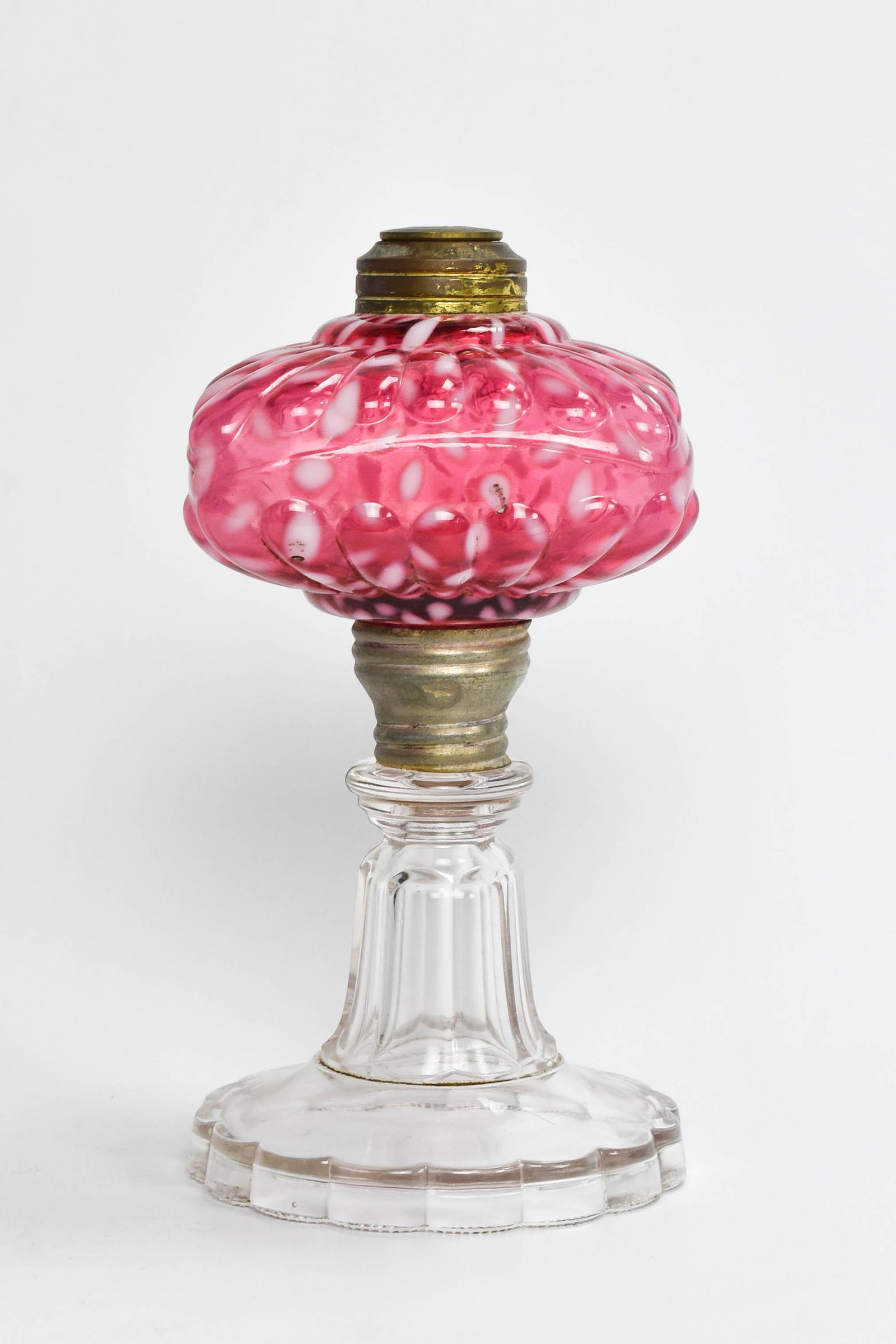 Hobbs Cranberry Snowflake EAPG Glass Oil Lamp: Circa 1890s. NO chips or cracks. This, and the other lamps offered, were all found in the Laughlin estate. However, unlike the flasks and pewter, we did not find any notes or receipts for the lamps.