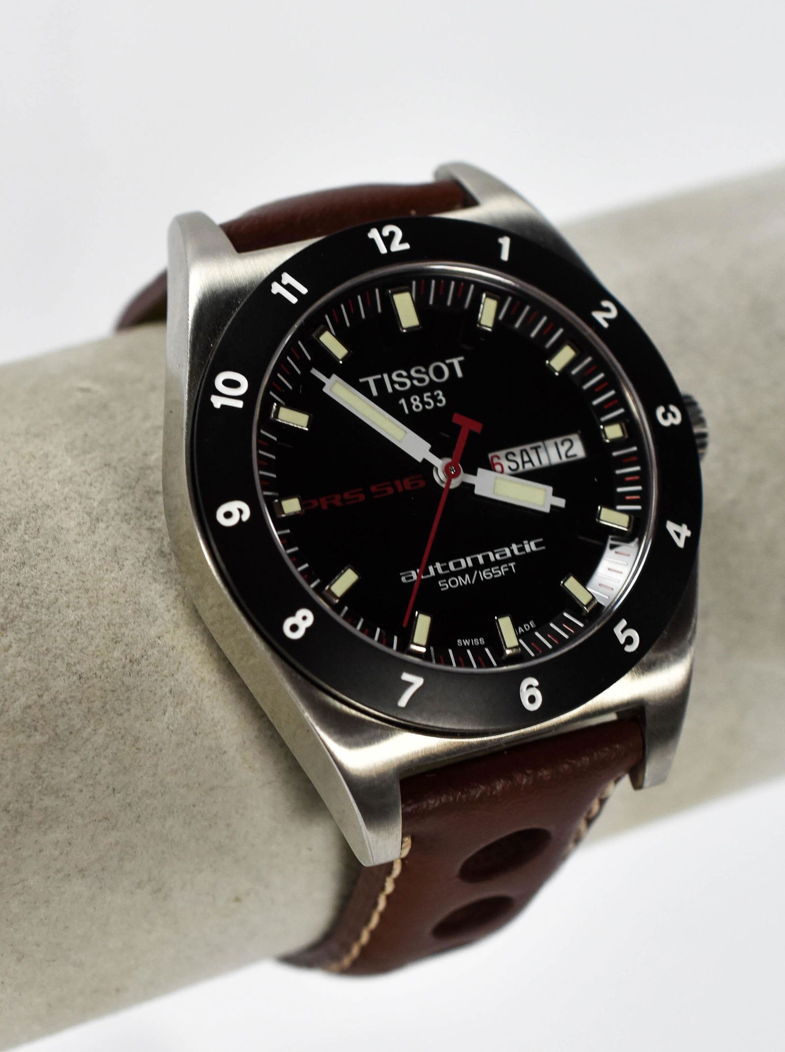 Tissot PRS-516 Auto Day/Date Men's SS Wristwatch: The excellent condition case measures approx. 40mm by 51mm (including lugs). The dial and crystal, excellent. The original Tissot racing leather band, also excellent. Watch works perfectly.