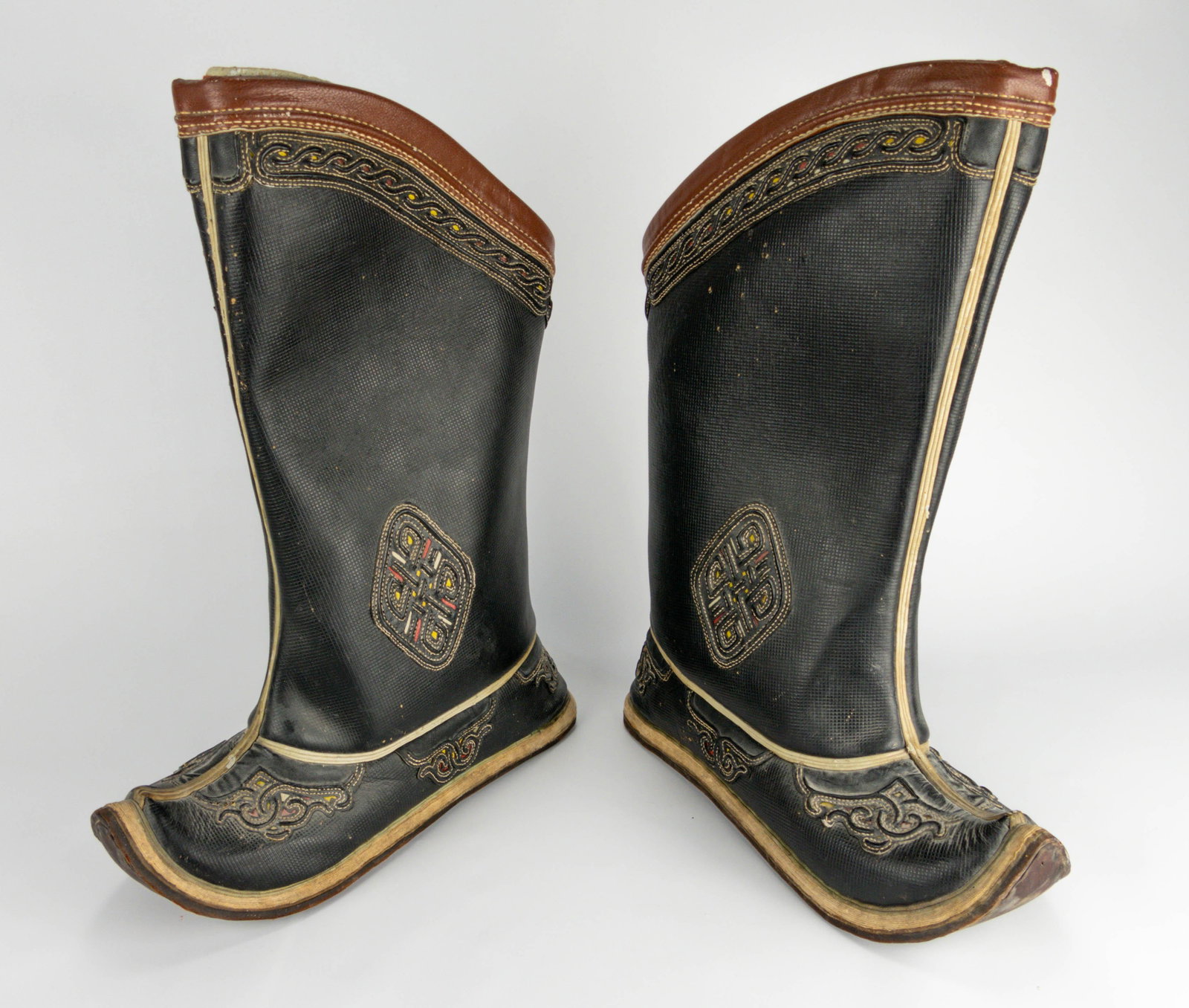 Old Traditional Multi Color Leather Tibetan Boots: 20thC. One side of one outer boot shows some surface nicks (see picture). Comes complete with inner boots. Hard to speculate on the size, maybe men's 9 or 10.