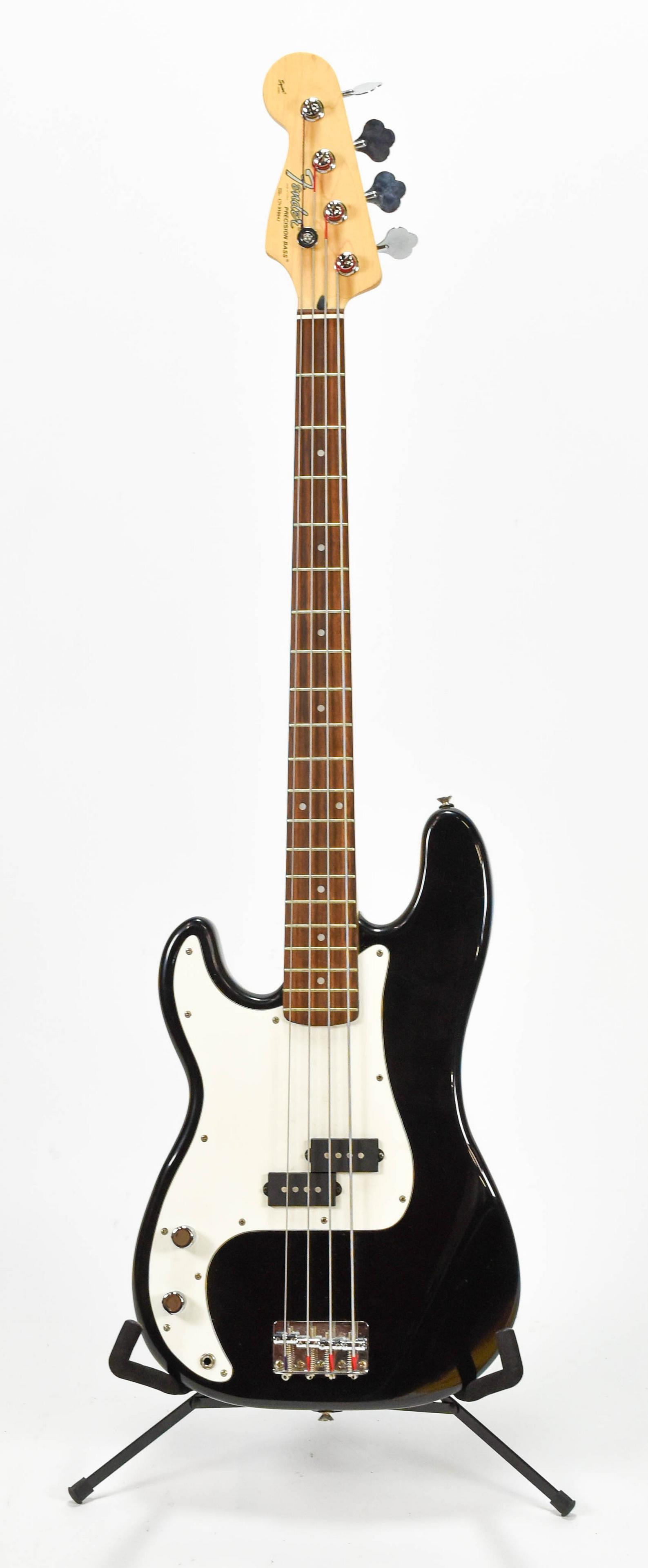 Black Fender Squire Precision Lefty Electric Bass: Serial #: CN310947. Excellent cosmetic condition as shown. Comes with fitted hard case in used condition.