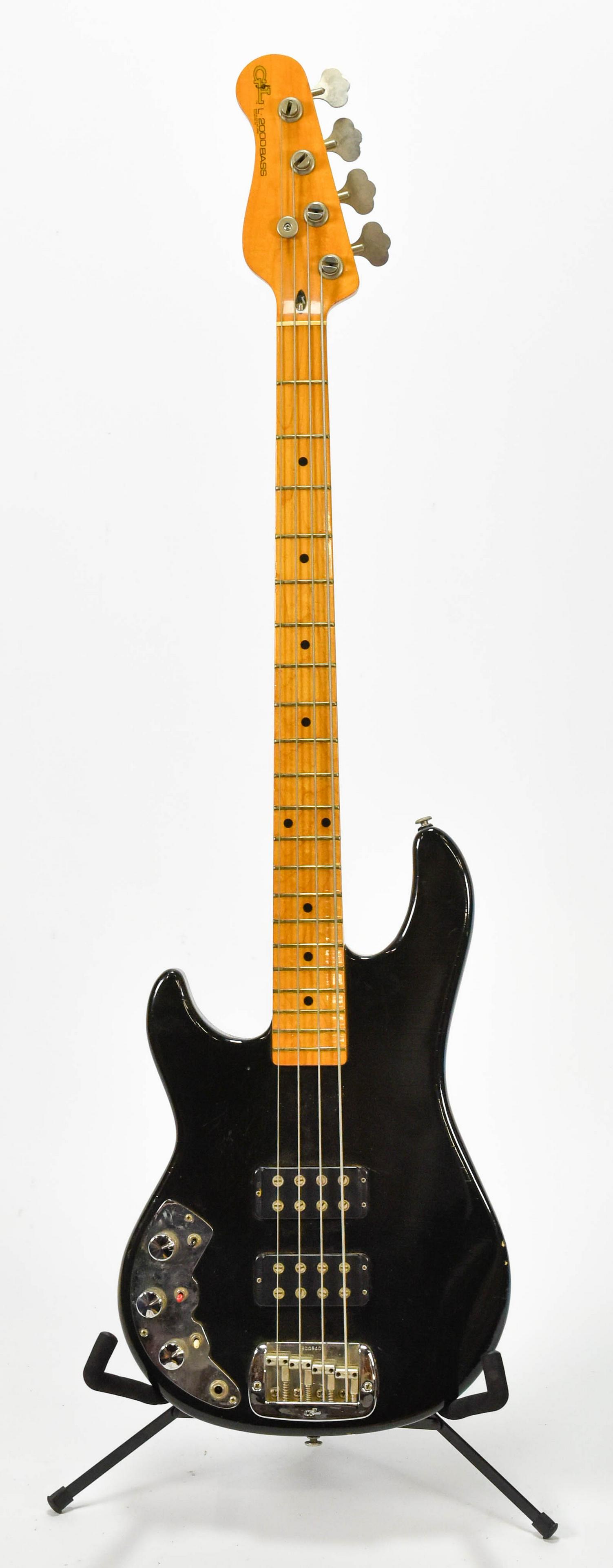 Black G&L L-2000 Electric Bass Guitar Lefty w/HC: Serial #: B005402. Overall good used condition with some nicks and metal corrosion. Case: 48" x 16.5" x 4"