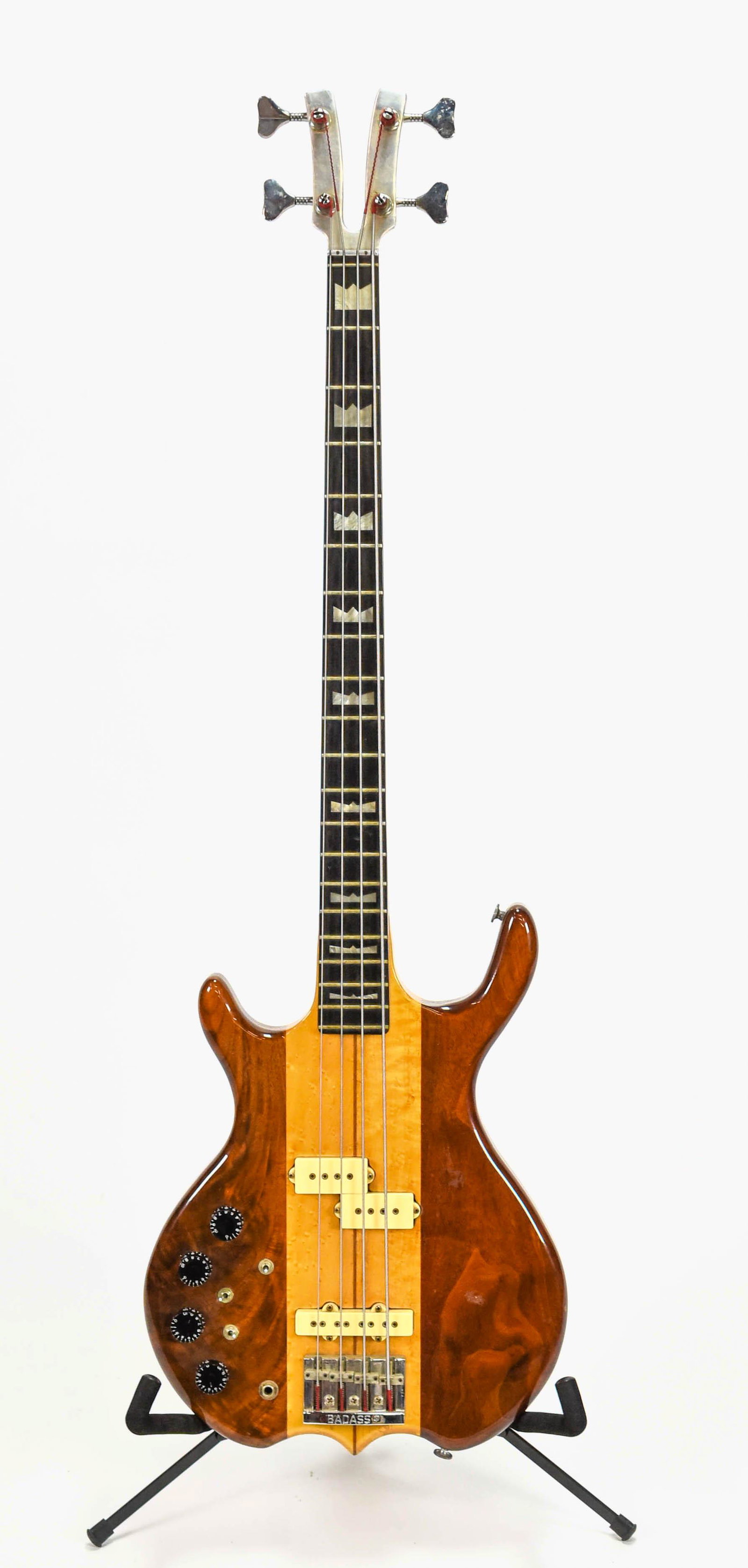 Electric Bass Guitar Frankenstein Type w/HC: LEFT HANDED. Good cosmetic condition, however, has slight warped neck. Will need neck and body separation to straighten due to wood/metal construction. Case: 15" x 48" x 5".