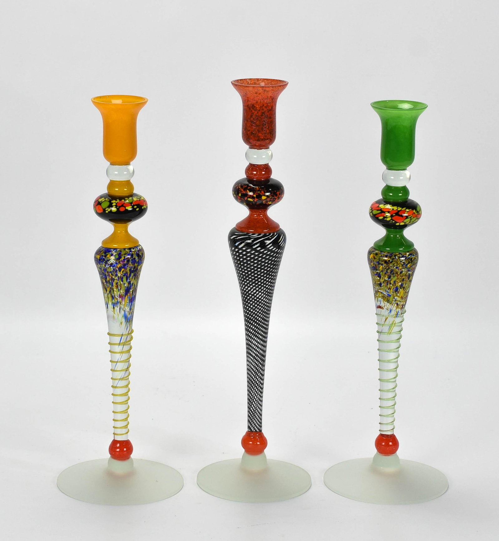3 Newt Grover Studio Art Glass Blown Candlesticks: Beautiful hand blown colors and form. No chips, cracks or repairs. Each signed as shown. Green: 15 x 5 x 5 Yellow: 15.5 x 5 x 5 Red: 16 x 4.5 x 4.5