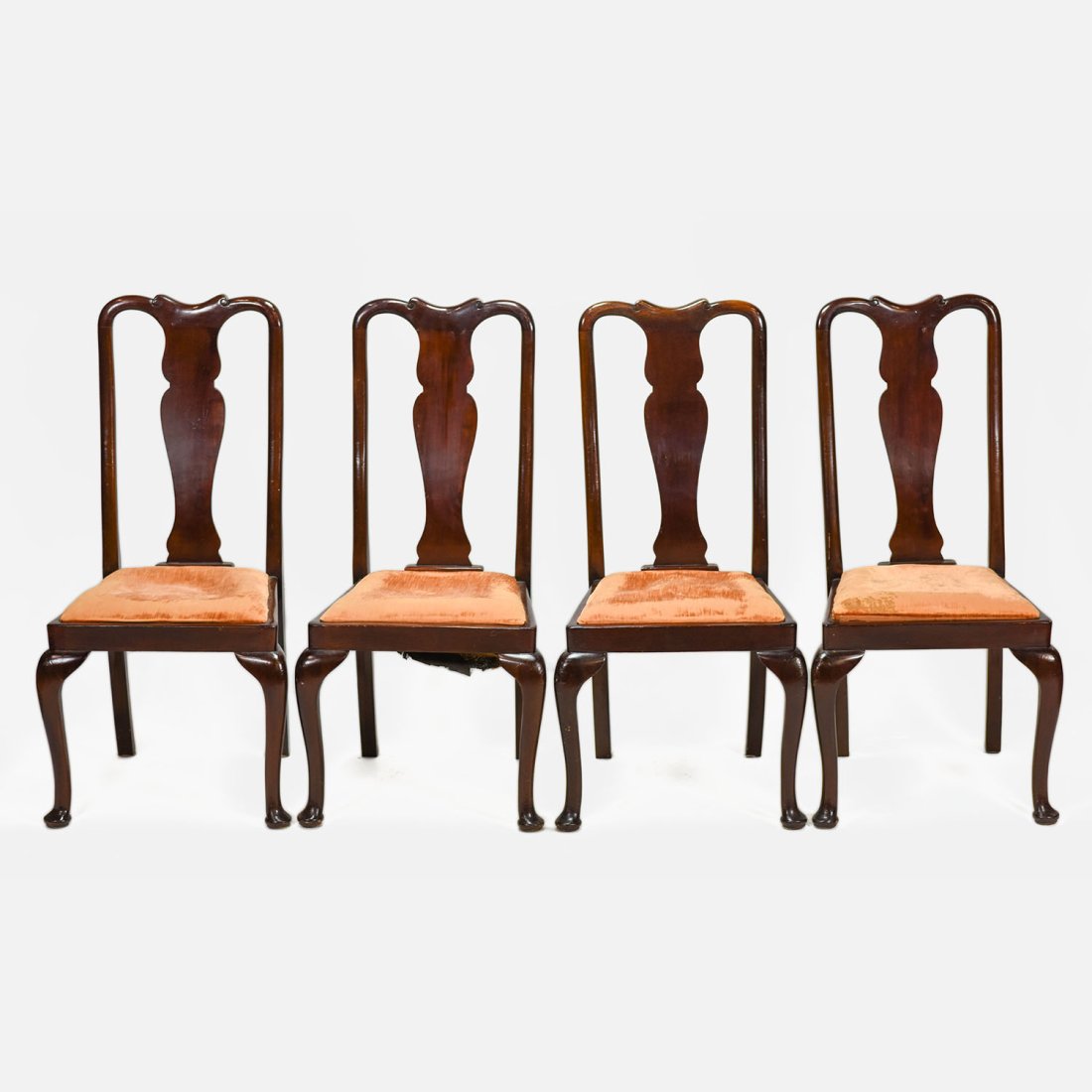 Set of Four Queen Ann Mahagony Dining Chairs: Ca. 20thC. Solid and sturdy, this is a good set to have on hand for extra guests. They look good enough to place around a room until needed. One chair has a repaired back leg, otherwise fine as shown.
