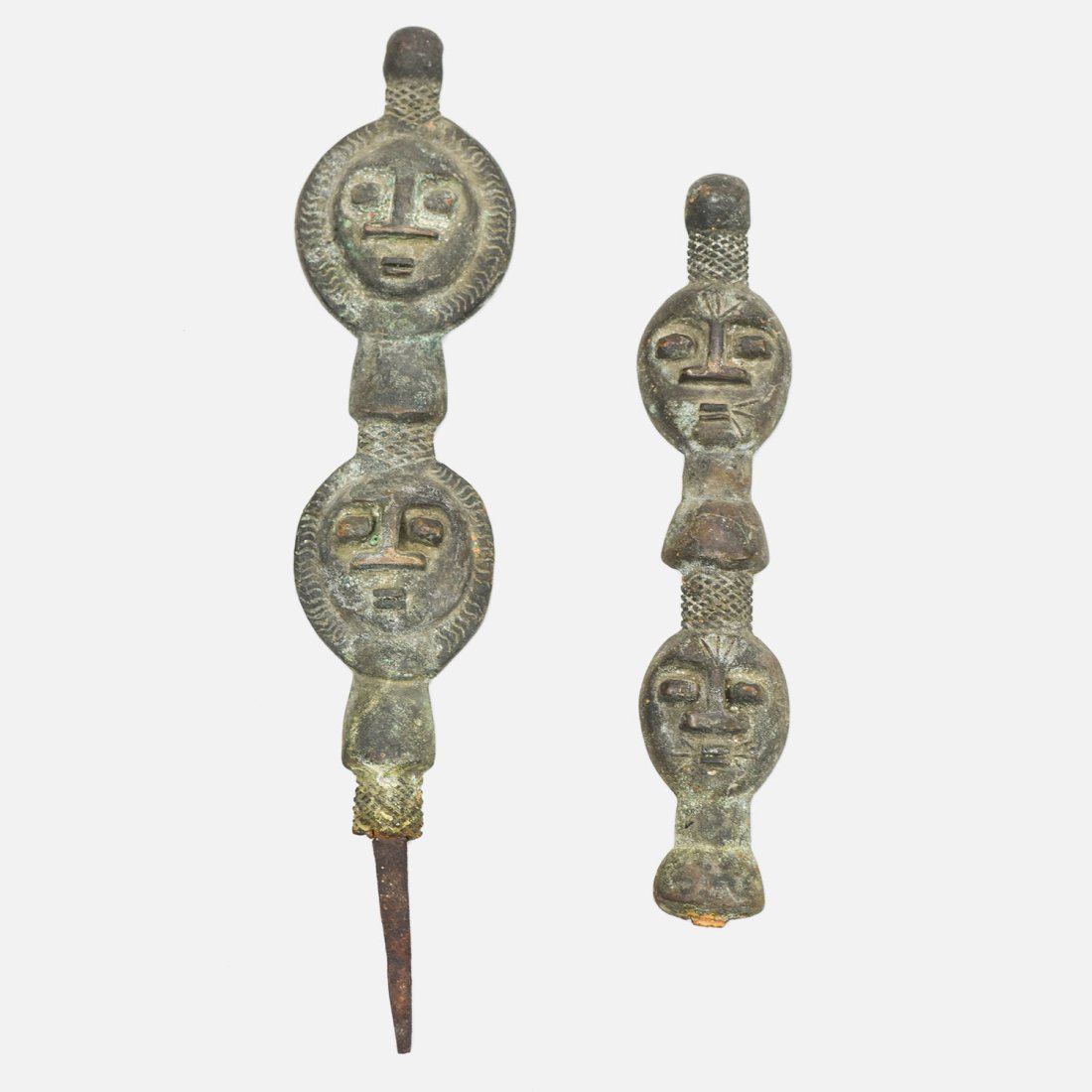 Antique African Heavy Bronze Tuareg Marker Figurines: Ca. First half 20thC. The larger piece (13.5" x 3") retains the iron spike, The smaller piece (10" x 2") is missing the iron spike. Otherwise both are in fine original condition as shown.
