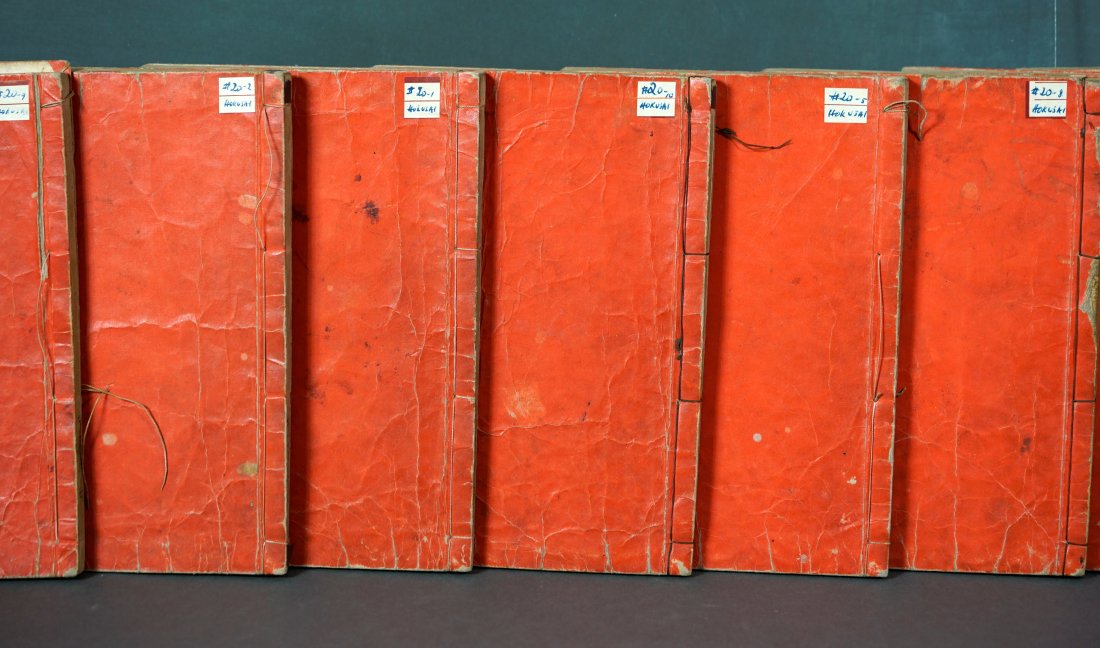 10 Vol Set Antique Japanese Woodcut Print Book Katsushika Hokusai: "Mangwa" by Katsushka Hokusai, volumes 1-10 (1812). 3 color woodblock prints. Each volume measures 6"w x 9"h and has orange covers. Vol. 1: Threading is nearly gone, pages are loose. no rips or tears 
