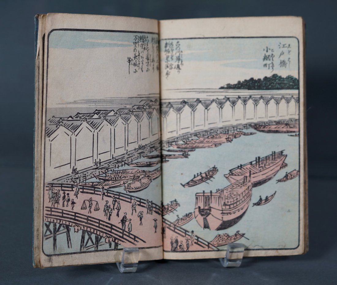 Antique Japanese Woodcut Print Book by Ichiryusai Hiroshige: Book of color woodblock prints, dusty blue cover. Measures 7.25"h x 4.75"w.Threading is intact, pages are still flexible, some darkening at lower corners of pages. No rips, tears, insect damage or mol