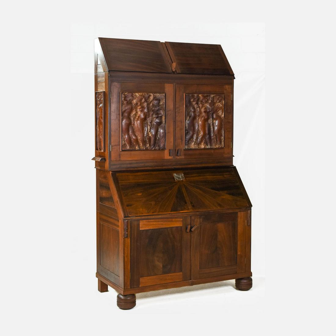 Karel Mikolas Cast Bronze and Carved Wood Nude Woman Bookcase Desk: Very good condition. Bronze and various hardwoods. Carved nude woman panels on the front and sides. Nude woman bronze key escutcheon. One-off piece with much documentation back and forth between Mikol
