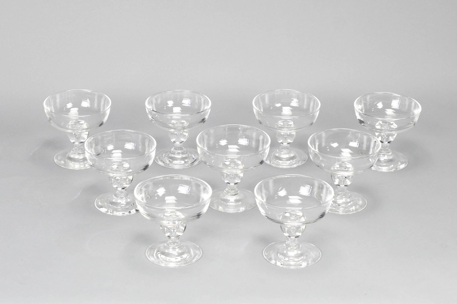 Nine Matching Steuben Crystal Bubble Stem Sherbet Glasses George Thompson: Excellent condition throughout. Retailed by The Halter Bros Co. Includes felt bags and storage box. Box: H: 5.5 W: 17 D: 13