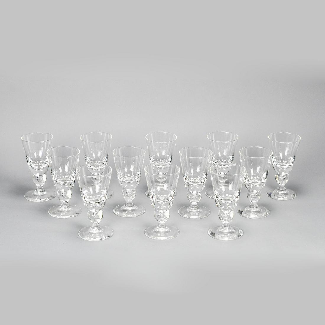 Twelve Matched Steuben Bubble Stem Crystal Water Glasses George Thompson: Excellent condition throughout. Fantastic glasses, large with substantial weight. Retailed by The Halter Bros Co. Includes individual felt bags and large gray storage box. Box dimensions: H: 7.5 W: 17