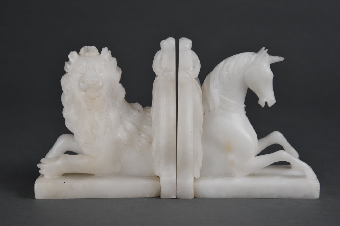 Vintage Carved White Alabaster Lion and Unicorn Bookends: Ca. first half 20thC. Very good original condition with only very light, minor edges "flea bitten". Remarkable condition actually. Very well carved, likely made in Italy.