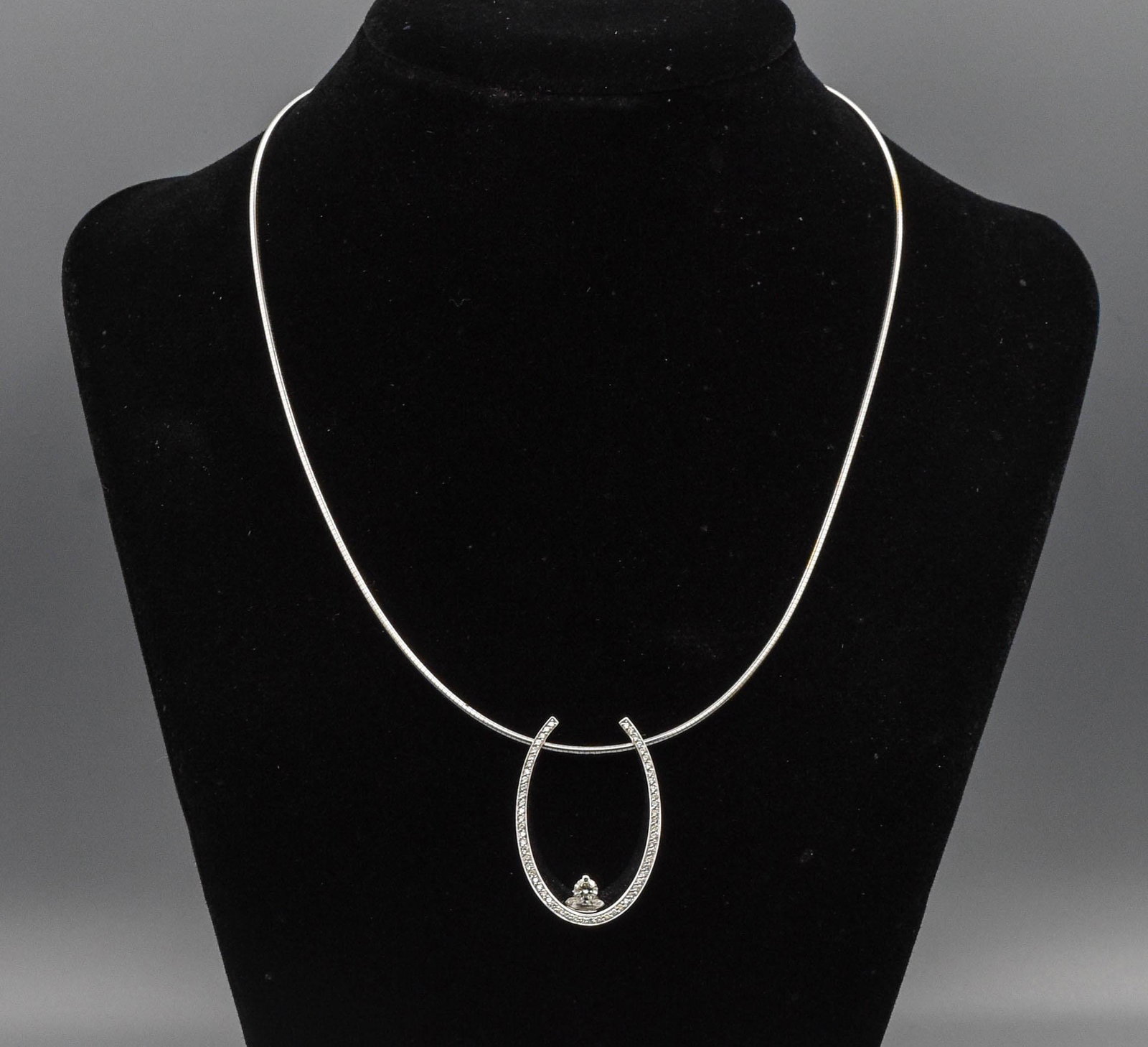 Italian 18k White Gold Diamond Pendant on Omega Chain Necklace: Total weight approx. 17.6 Grams. Necklace 16" Long. Pendant 1 3/8" x 7/8". Center Diamond approx 3 1/2mm with all other diamonds approx 3/4mm each.