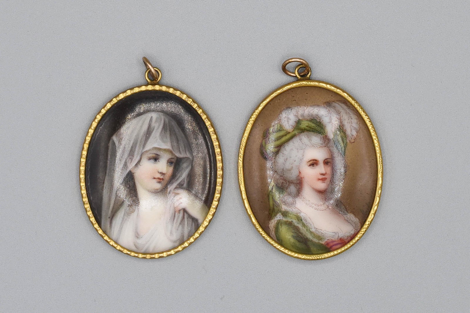 Two Painted Porcelain Gold Filled Pendants: Excellent with no chips or cracks. Each pendant measures approx. 2 1/8" x 1 1/2".