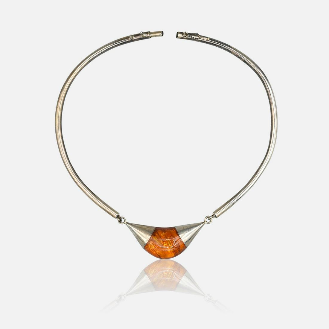 Vintage Sterling Silver and Baltic Amber Solid Tube Stationary Necklace: Ca. last half 20thC. Apparently unmarked, this tested sterling silver. Approx. 16", with the center amber portion approx. 3" x 1". Excellent, needing only polishing. No dents or dings on the hollow tu