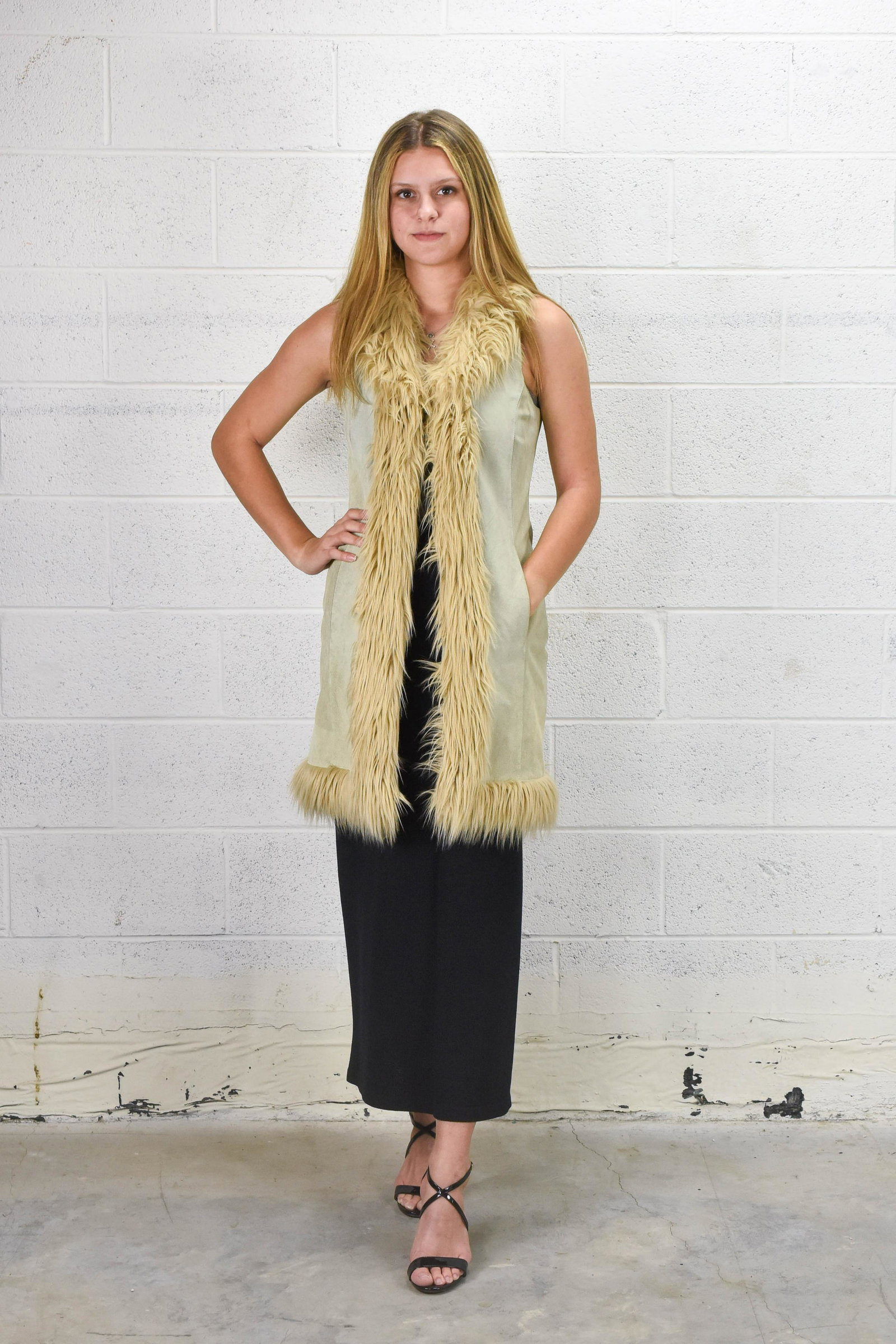 WILSONS LEATHER Faux Fur and Leather Vest Coat: Measurements- Armpit to armpit: 17" Length: 36".