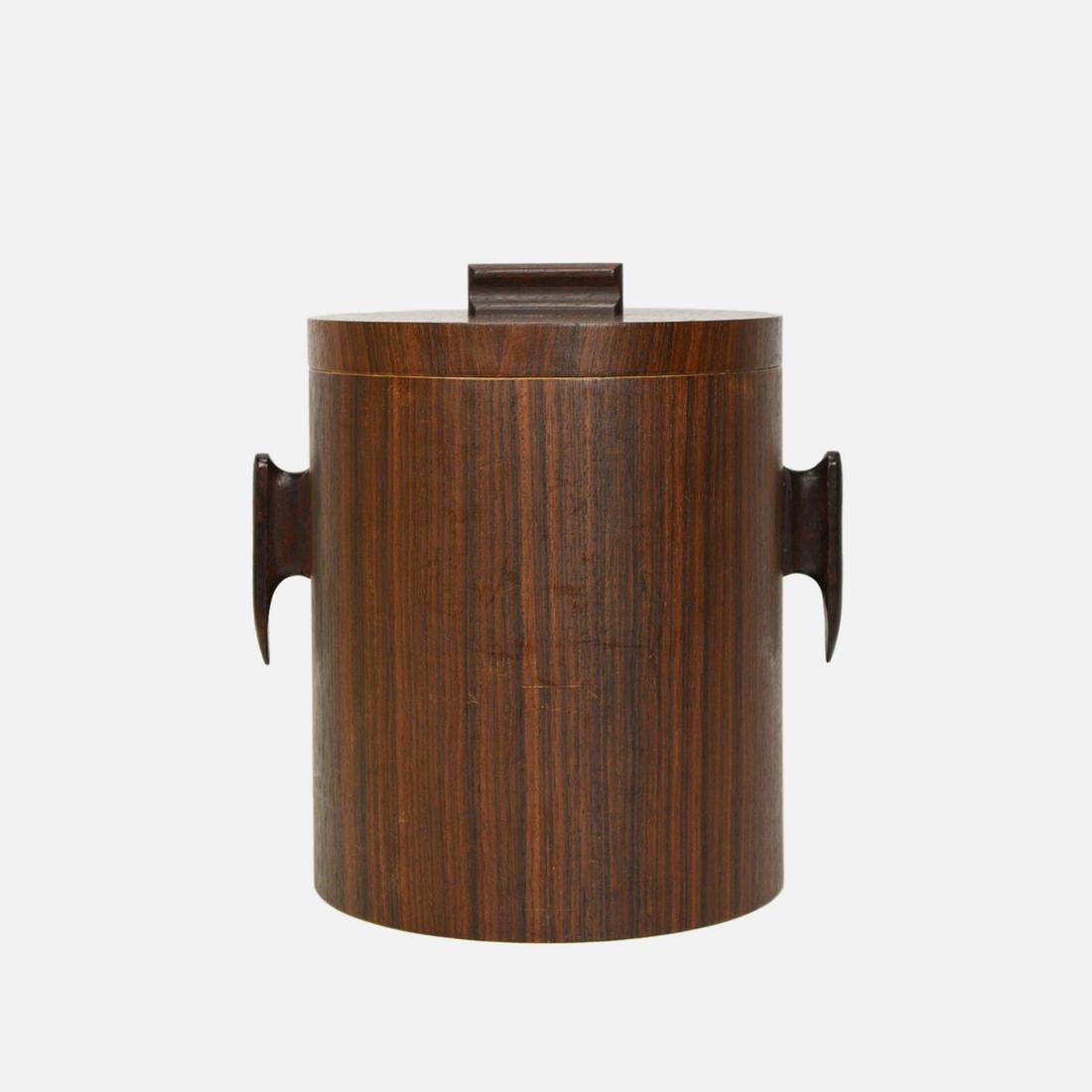 Jean Gillon Style Rosewood MCM Ice Bucket: Ca. second half 20thC. Great quality and striking Mid-Century Modern striped rosewood ice bucket, in Jean Gillon style. Good condition with no cracks or repairs. A Mid-Century Modern sculpted rosewood